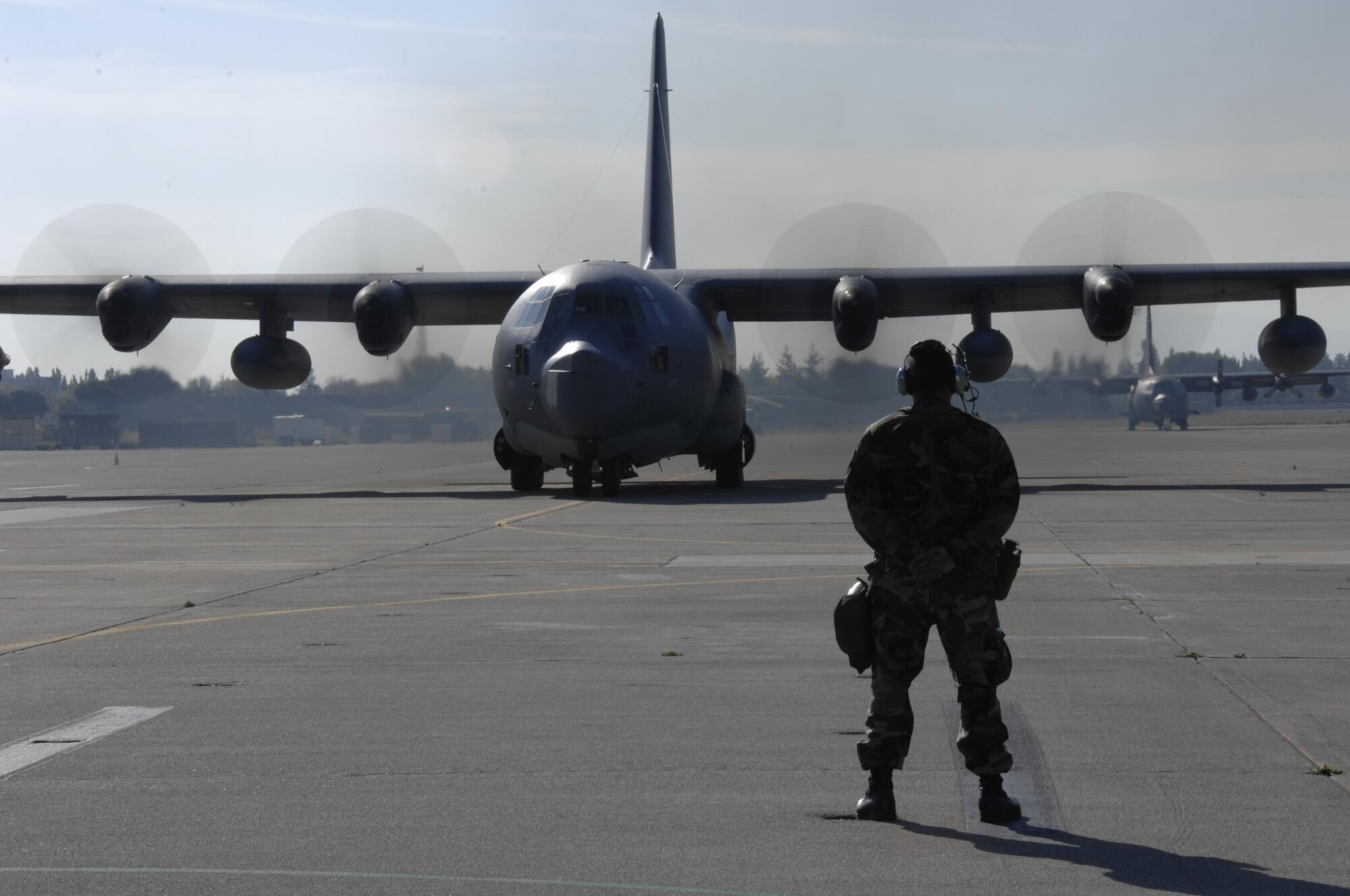 Two MC-130P Combat Shadow tanker aircraft from the 129th Rescue Wing, Moffett Federal Airfield, Calif., taxi on the Moffett flightline. (U.S. Air Force photo by Master Sgt. Daniel Kacir) 