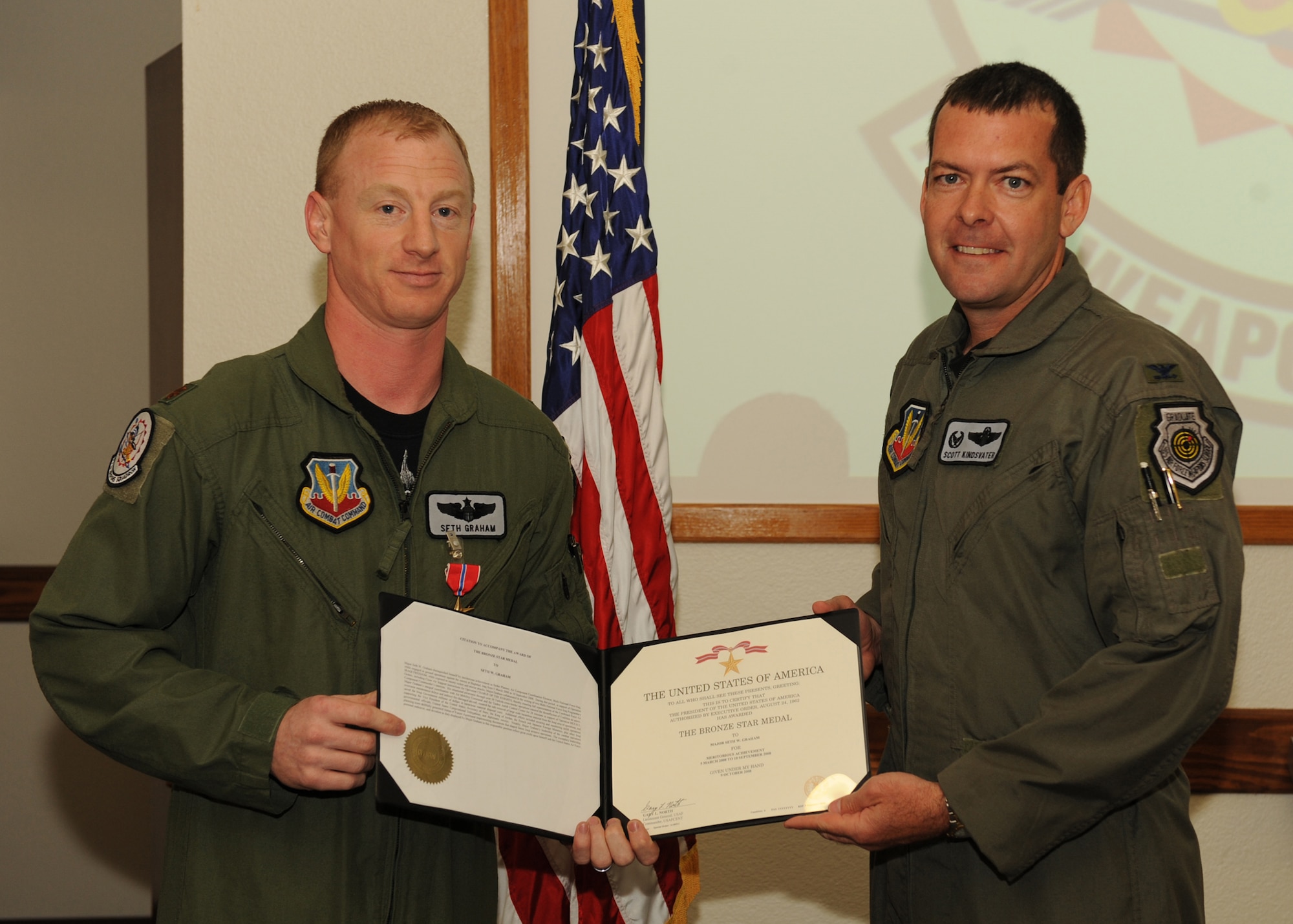 DYESS AIR FORCE BASE, Texas - Maj. Seth Graham was presented the Bronze Star April 17, here by Col. Scott Kindsvater. He received the medal for actions in support of Operation Iraqi Freedom. (U.S. Air Force photo by Staff Sgt. Joel Mease)