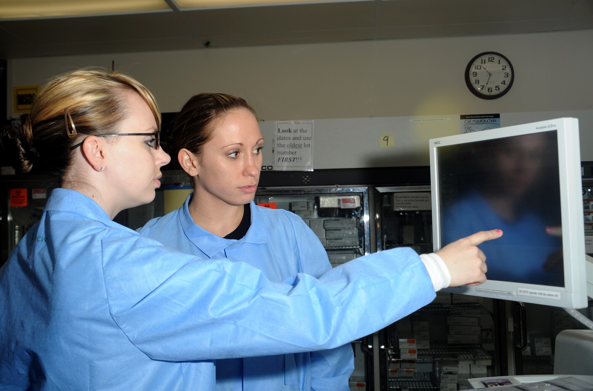 ELMENDORF AIR FORCE BASE, Alaska-- Senior Airman Leslie Balliew and Airman 1st Class Heather Long of 3 Medical Support Squadron examine test results on April 15, 2009. Lab technicians are vital to our health care, providing us critical information by detecting unknown health problems and aiding in the diagnosis and treatment of known conditions. (U.S. Air Force photo by Airman First Class Kristin High)