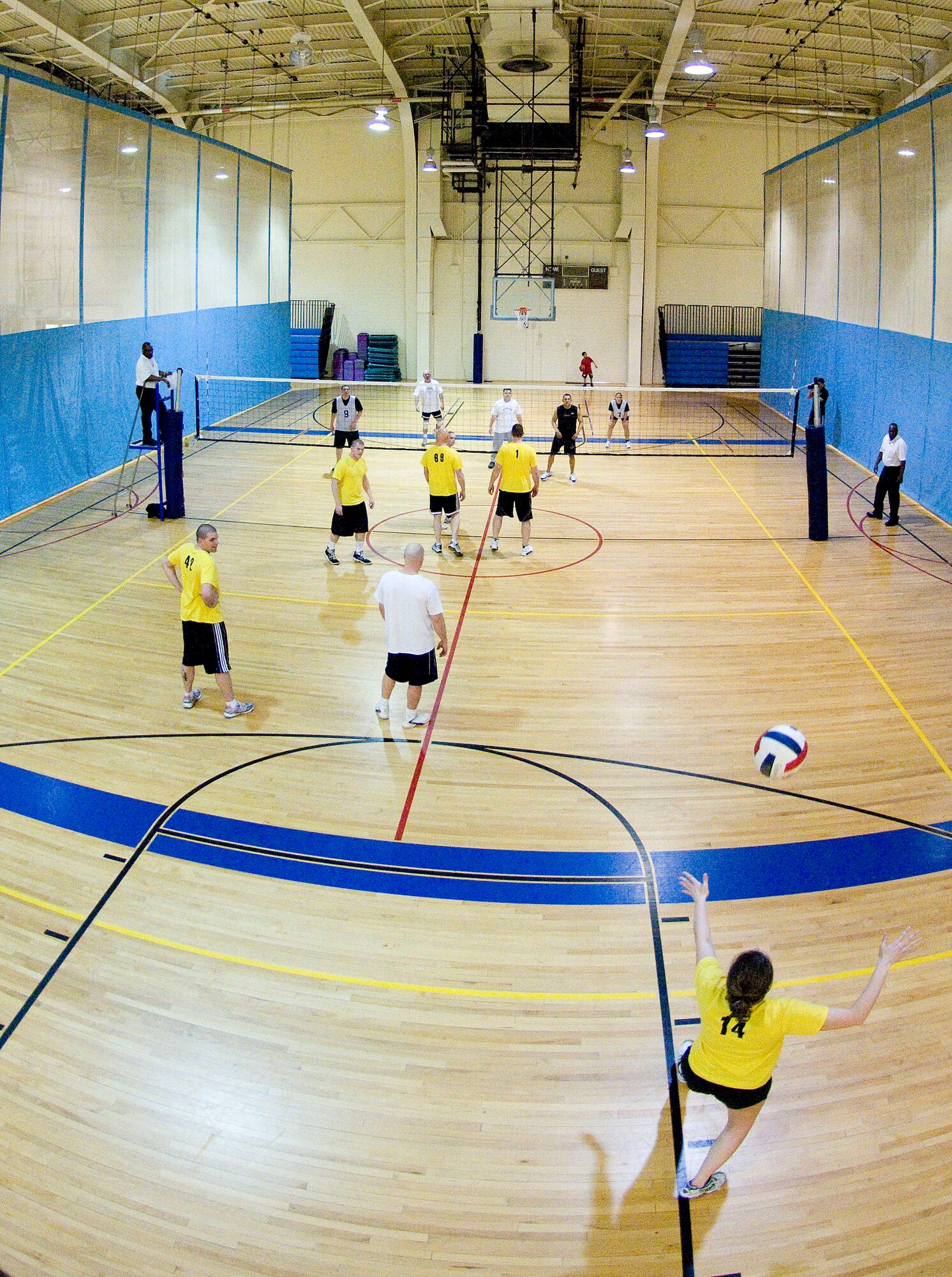 ELMENDORF AIR FORCE BASE, Alaska-- Airman 1st Class Angela Daniels serves against 611 Civil Engineer Squadron, who is ready to return it back to the 732 Air Mobility Squadron April 20, 2009. Angela and the rest of the 732 AMS beat the 611 CES in a volleyball match.. (U.S. Air Force photo by Senior Airman Jonathan Steffen)  