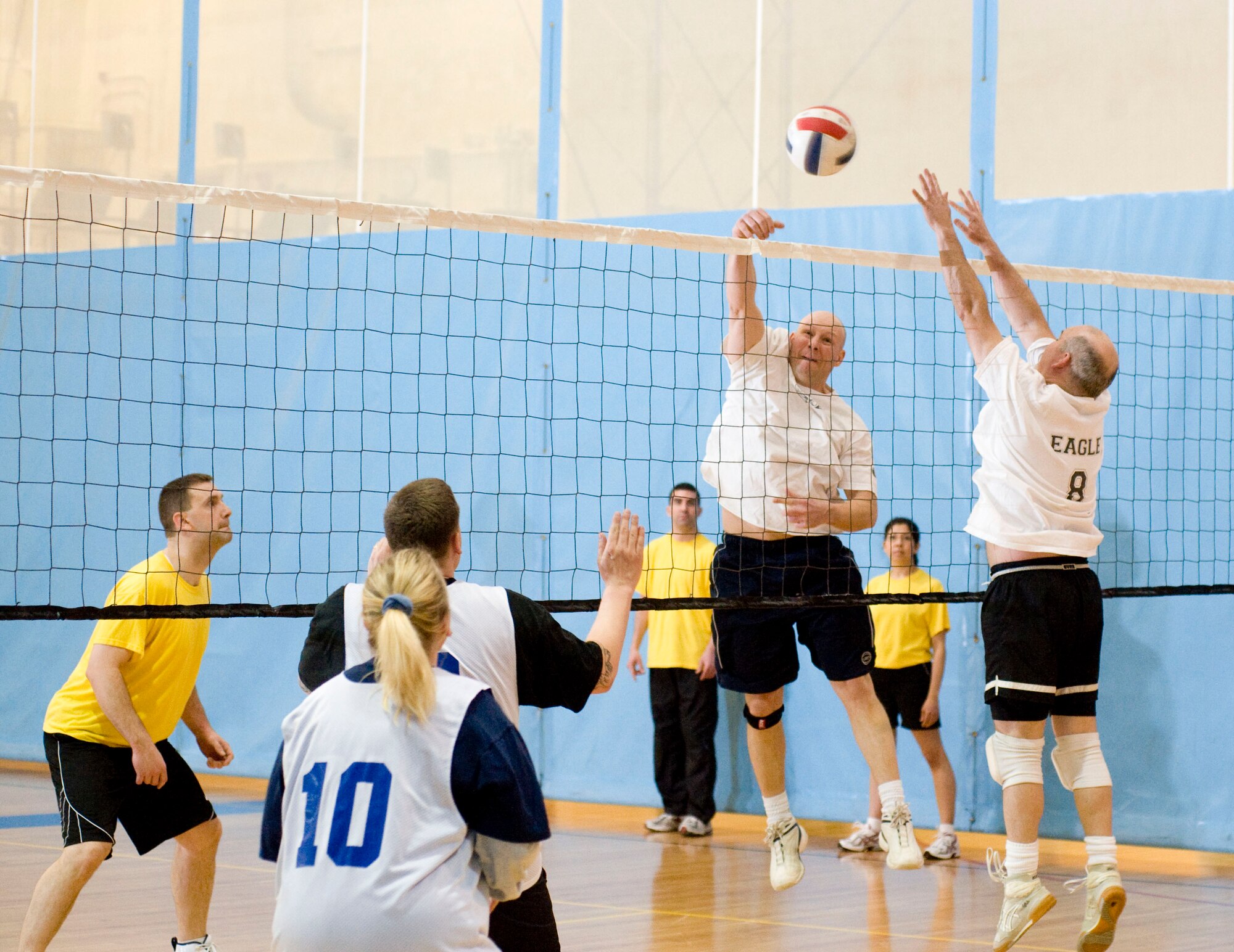 ELMENDORF AIR FORCE BASE, Alaska-- Master Sgt. Robert Midlo hits ball over the net where 611 Civil Engineer Squadron is ready to return it back to the 732 Air Mobility Squadron April 20, 2009.  Midlo and the rest of the 732 AMS beat the 611 CES in a volleyball match. (U.S. Air Force photo by Senior Airman Jonathan Steffen)  