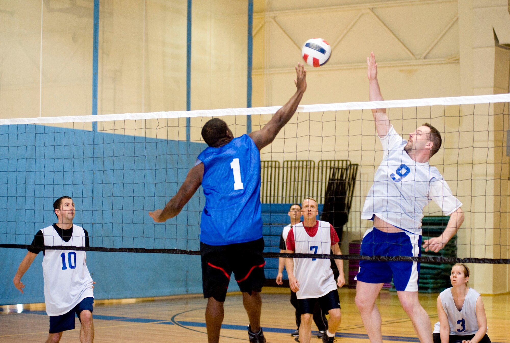 ELMENDORF AIR FORCE BASE, Alaska-- Staff Sgt. Corey Little and Airman 1st Class Jason Engle jump for the ball during a match between 3 Operations Support Squadron and the 517 Airlift Squadron April 20, 2009. Corey is from 3 OSS and Airman Engle is from 249 AS playing for 517 AS. The 517 AS won the match against 3 OSS. (U.S. Air Force photo by Senior Airman Jonathan Steffen)  