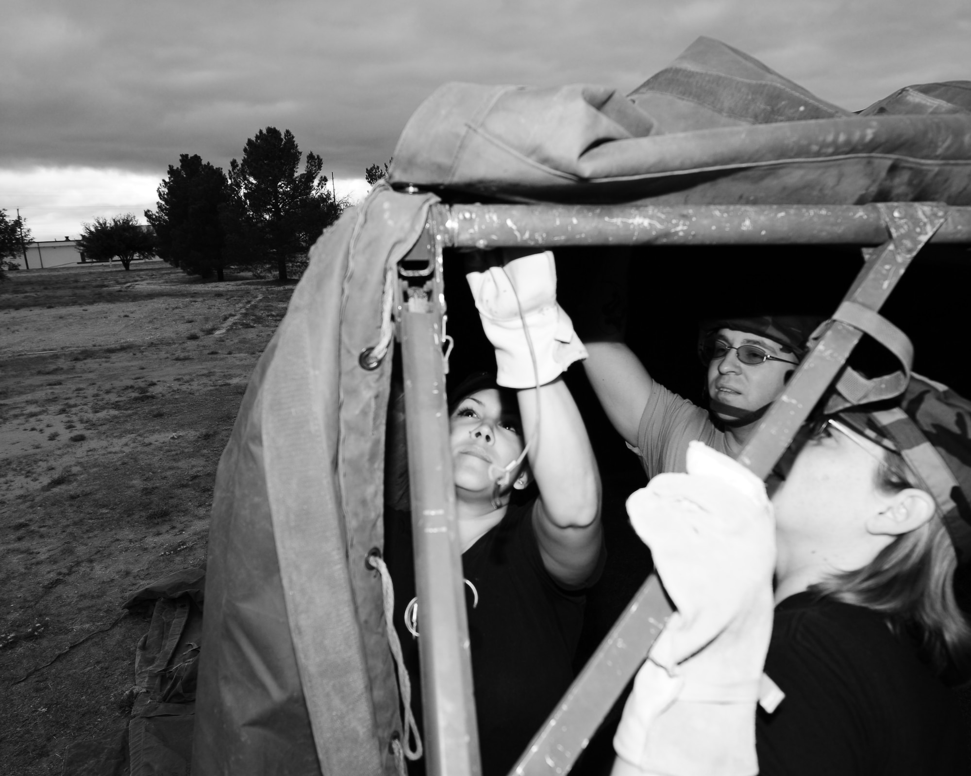 DYESS AIR FORCE BASE, Texas - Members of the 7th Force Support Squadron erect a tent during a home station readiness training here Friday, 17 April.  The tent build up was part of an exercise conducted by the FSS to prepare their Airman for the possibility of being forward deployed to a bare base.  (U.S. Air Force photo by SSgt Alan Garrison)
