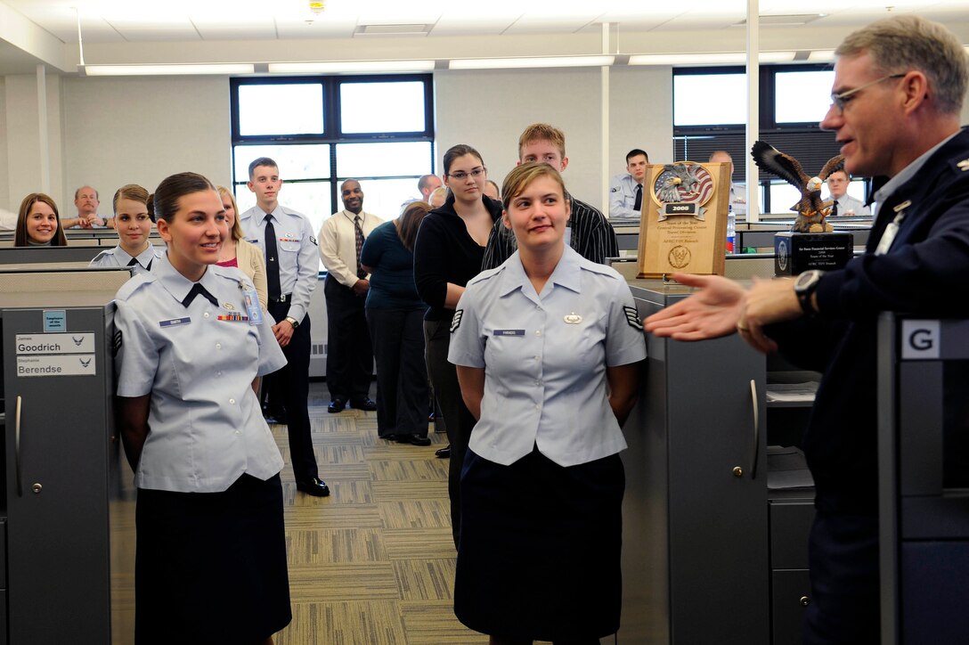 (Right) Col. Joseph S. Ward Jr., Air Force Material Command Financial Management  director, speaks with Air Force Financial Services Center Airmen and civilian personnel here, April 20. Colonel Ward visited each section of the Air Force Financial Services Center to get a better understanding of how the center completes its mission. (U.S. Air Force photo by Airman First Class Corey Hook)