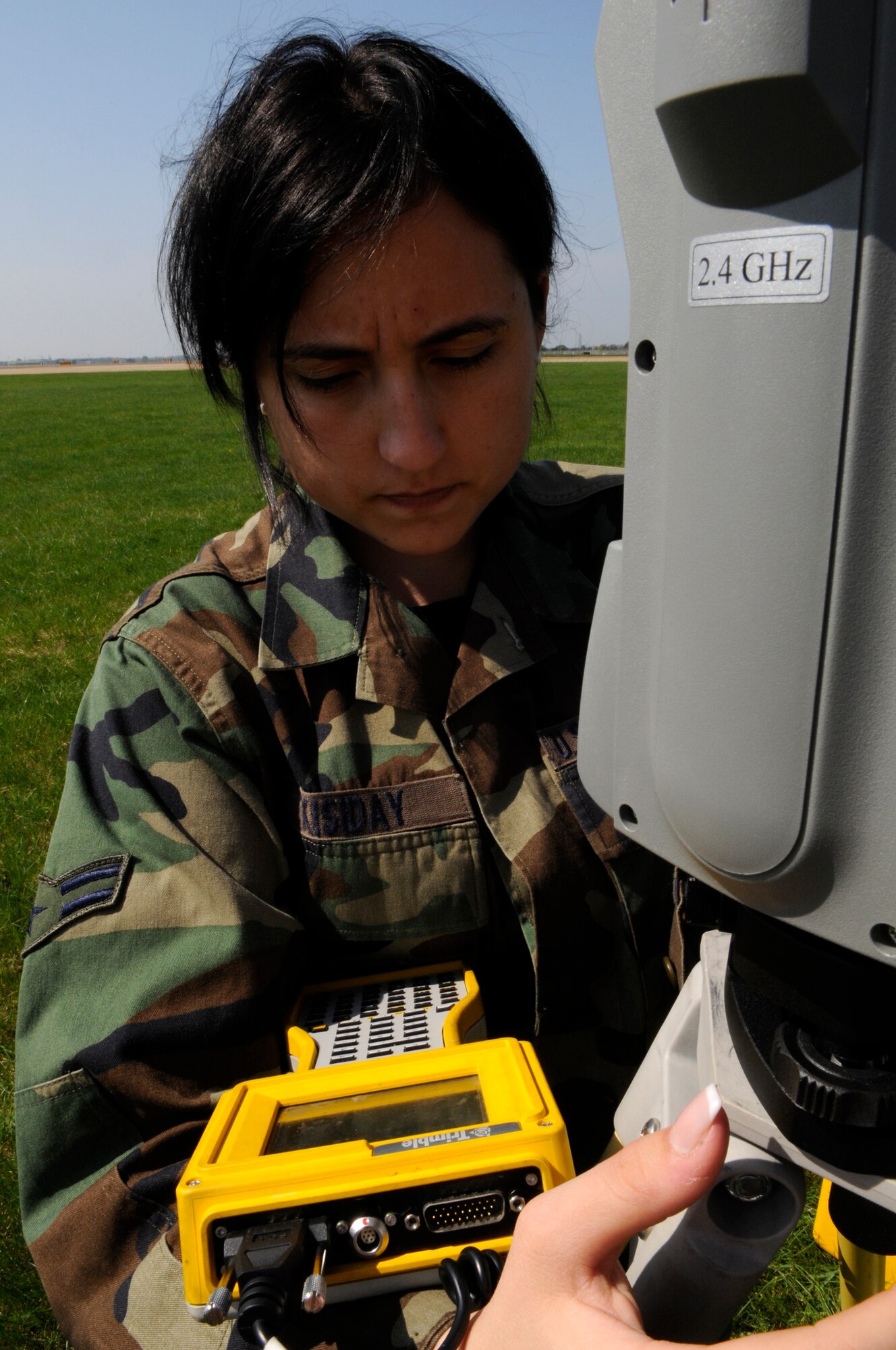 Airman 1st Class Angela Kisiday, 100th Civil Engineer Squadron Geo-Base technician, calibrates her surveying equipment at RAF Mildenhall, April 21.  Geo-base technicians go through four months of technical training as well as on-the-job training in order to provide first-rate surveying to Air Force bases worldwide.  (U.S. Air Force photo by Senior Airman Christopher L. Ingersoll)