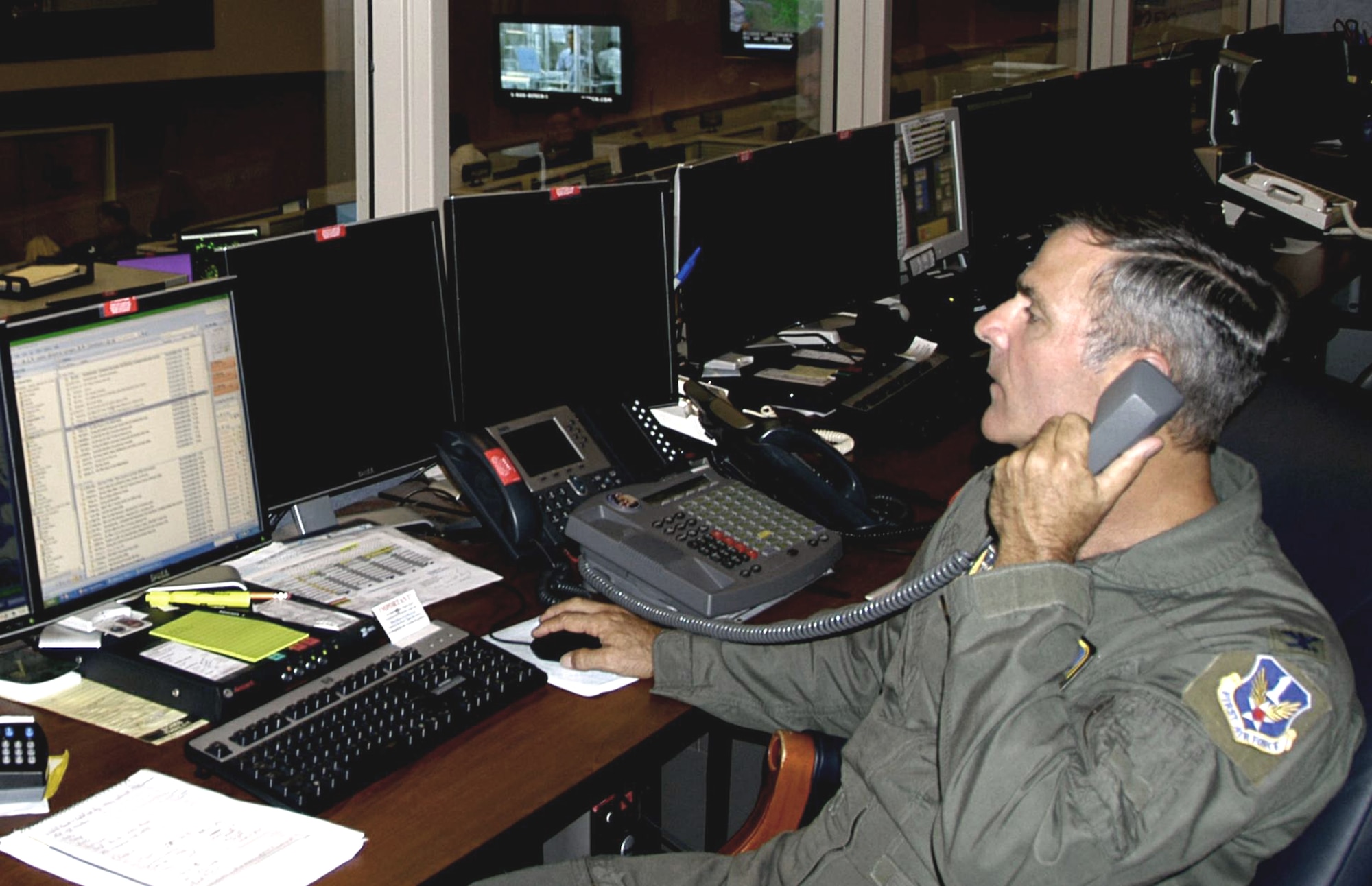 Col. Michael Hare, Air Force National Security Emergency Preparedness director, monitors Hurricane Gustav on the operations floor of the air operations center at Tyndall Air Force Base, Fla., prior to landfall. AFNEP officials are in charge of deploying emergency preparedness liaison officers, when requested, to coordinate military assets to support civil authorities. (U.S. Air Force photo/1st Lt. Jared Scott) 
