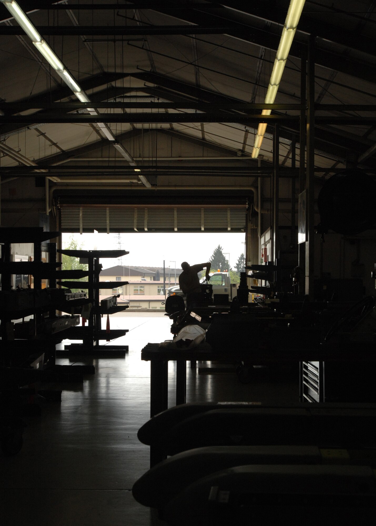 SPANGDAHLEM AIR BASE, Germany -- A silhouette is cast as Airman 1st Class Derek Fisher, 52nd Equipment Maintenance Squadron, works in the 22nd Cast section April 15, 2009. (U.S. Air Force photo by Senior Airman Jenifer H. Calhoun)  