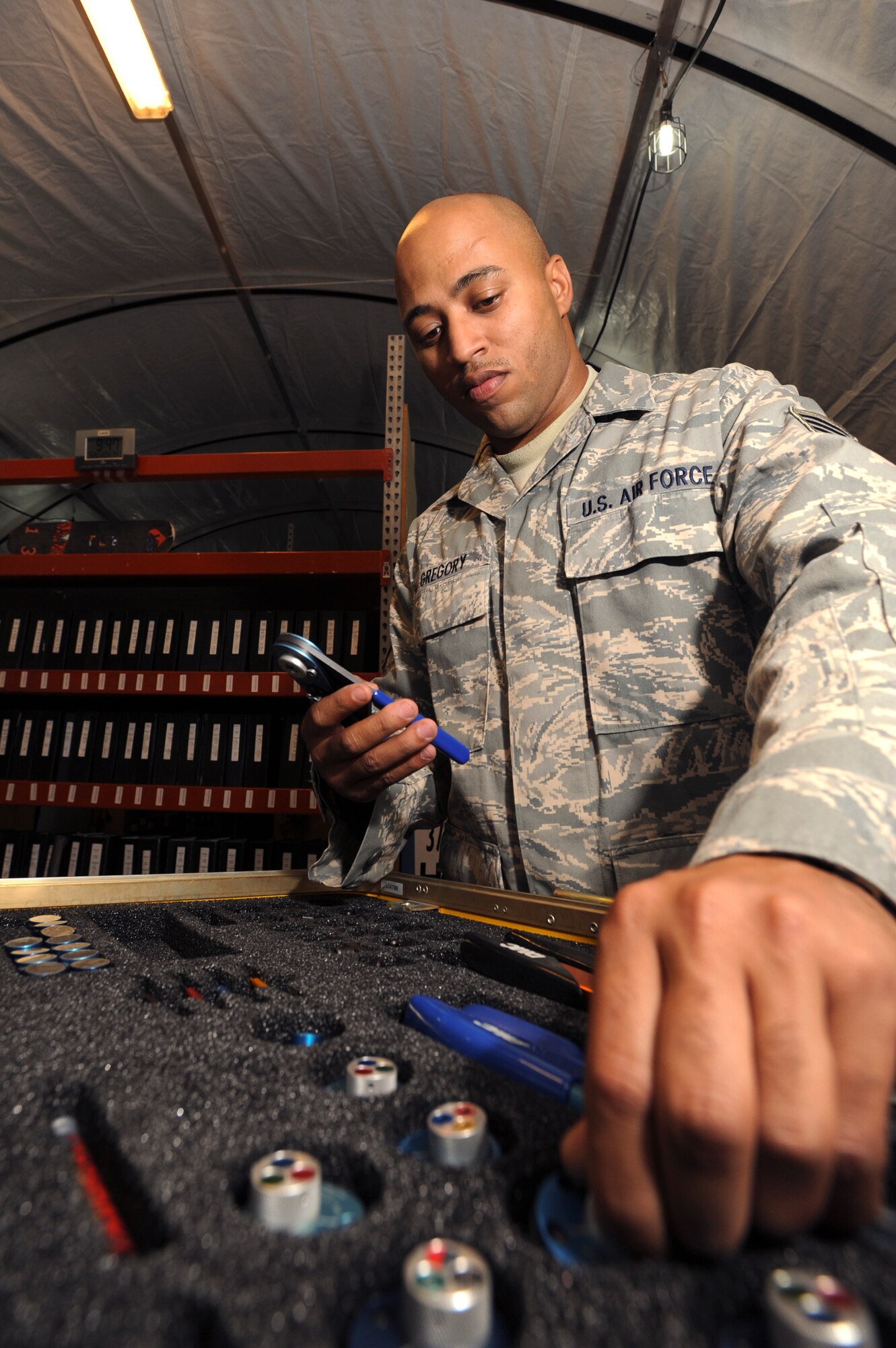 Staff Sgt. Ivan Gregory, an avionics technician with the 746th Aircraft Maintenance Unit, performs a 60 day inspection on a Daniels Tool Kit, April 20, 2009, in an undisclosed location in Southwest Asia.  The tool kit is used to repair wires on an aircraft and is inspected periodically to ensure it is functioning properly. Sergeant Gregory hails from Cleveland, Ohio and is deployed from Youngstown Air Reserve Station, Ohio in support of Operations Iraqi and Enduring Freedom and Combined Joint Task Force - Horn of Africa.  (U.S. Air Force Photo by Staff Sgt. Joshua Garcia/released)