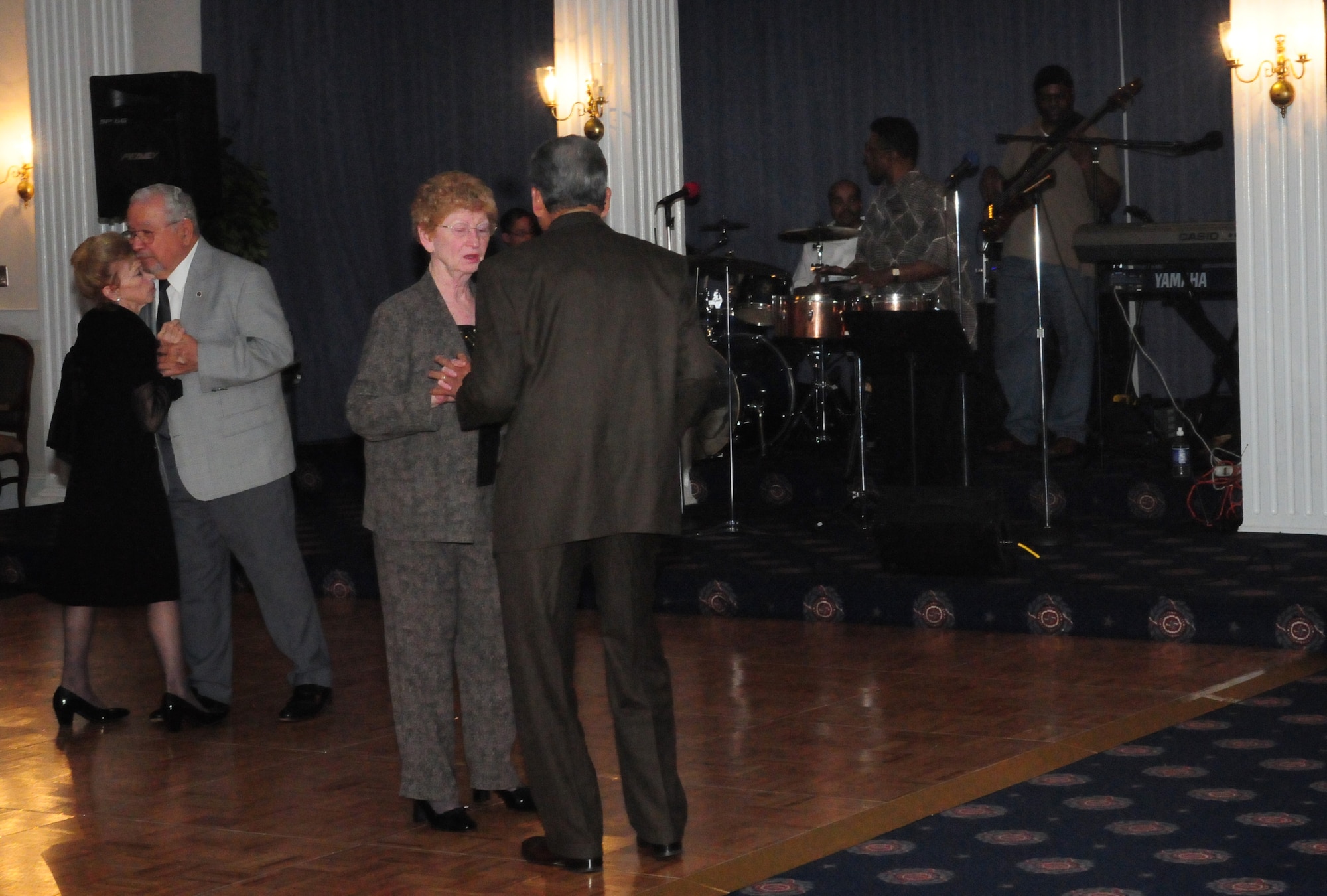 Couples dance to live music from the smooth jazz band Finesse at the Bolling Club's 75th Anniversary Dinner Dance April 18 in the Washington Dining Room. In its 75 years, not only has the Bolling Club been the site of annual awards ceremonies, wing promotions and retirements, but it has also been host to guests such as the Tuskegee Airmen, Air Force chiefs of staff and former president George W. Bush. The Bolling Club is open for lunch Tuesdays-Fridays from 11 a.m. to 1:30 p.m., dinner Wednesdays-Fridays from 5 to 8 p.m. and Sunday brunch from 10:30 a.m. to 2:30 p.m. For more information or to make reservations, call (202) 563-8400. (U.S. Air Force photo by Airman 1st Class Susan Moreno)