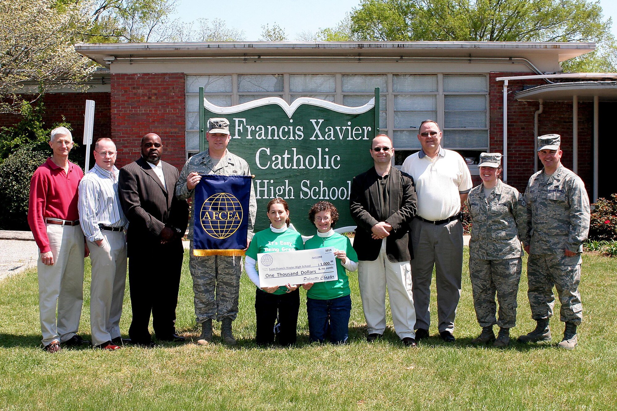 SUMTER, S.C. -- Members of the Armed Forces Communications and Electronics Association made a $1,000 donation to the Francis Xavier Catholic High School in Sumter, S.C. April 9, 2009. AFCEA solicited several local high schools, and Francis Xavier Catholic High School won based on their need to purchase new microscopes and improve their science lab. (courtesy photo)
