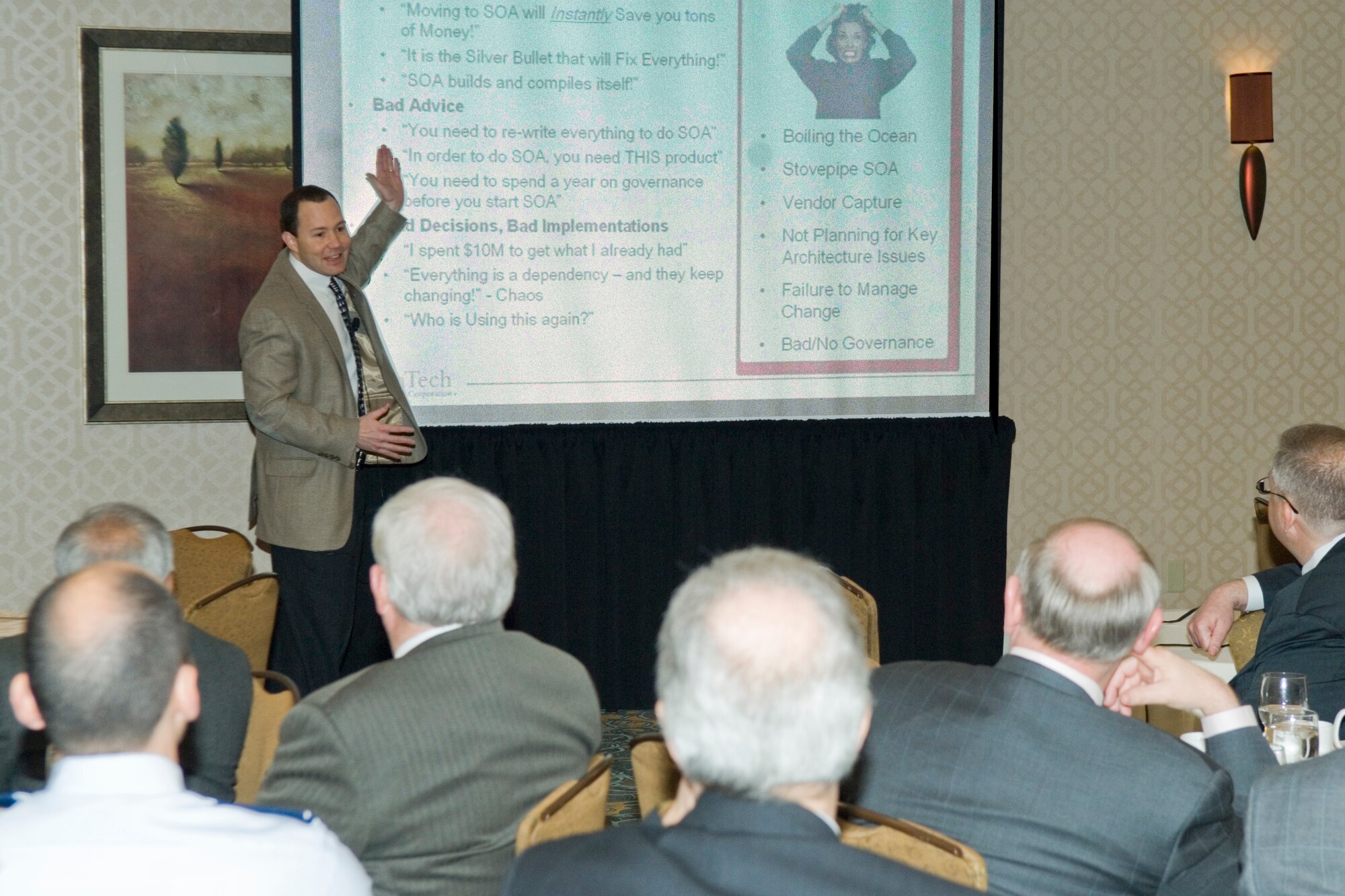 Kevin Smith of ManTech Corp. discusses services-oriented architectures during an April 17 Military Affairs Council breakfast meeting at the Doubletree Bedford Glen Hotel in Bedford, Mass.  Electronic Systems Center’s chief technology officer, Dr. Tim Rudolph, provided a complementary government briefing on the subject, too.  (U.S. Air Force photo by Rick Berry) 