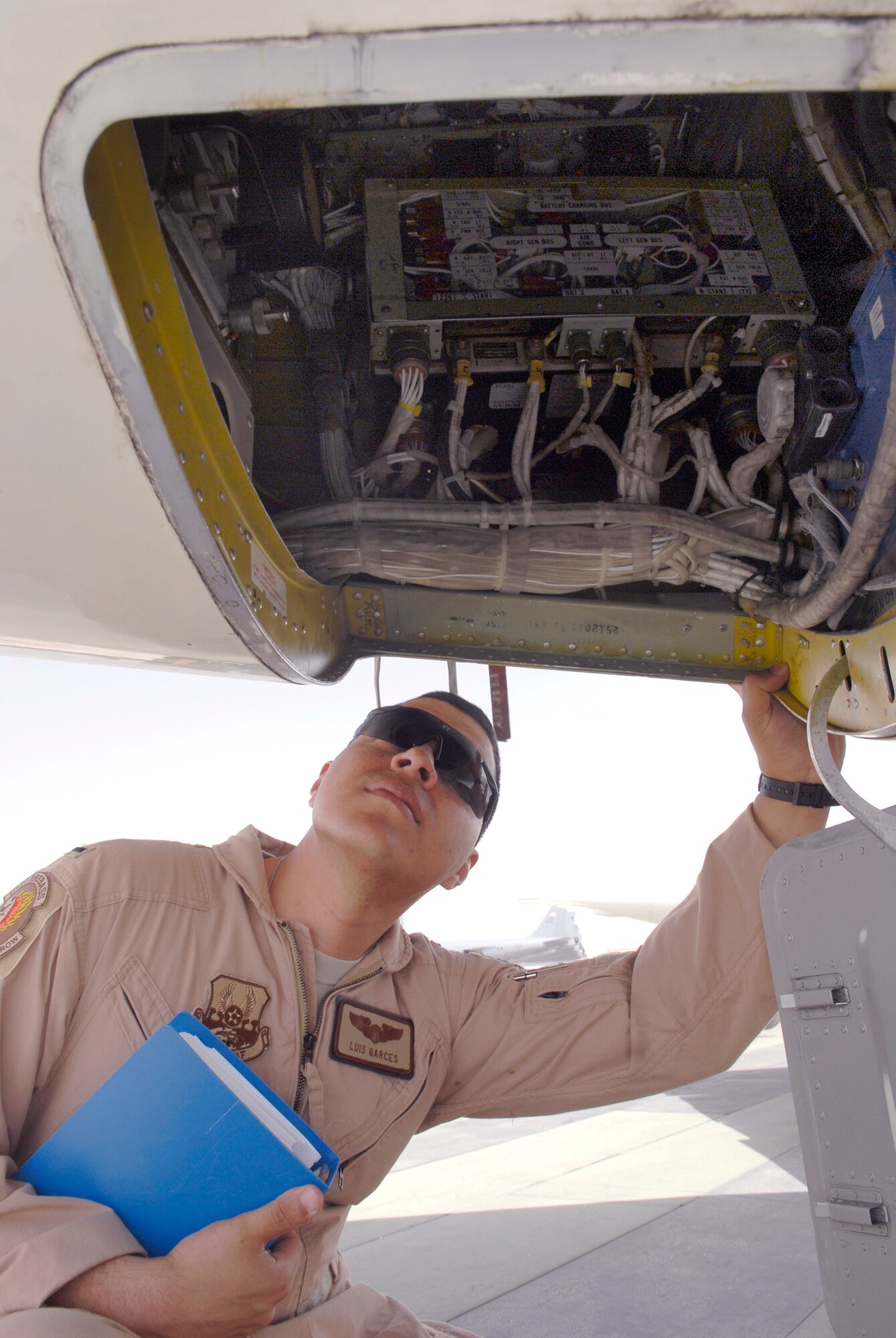 1st Lt. Luis Garces, a 379th Expeditionary Operations Group C-21 Pilot, checks the tailcone interior during a routine pre-flight inspection on a USAF C-21 aircraft, Apr. 15, 2009, at an undisclosed location in Southwest Asia.  The C-21 is an operational support airlift aircraft for transporting personnel and provides emergency medical evacuation transport if needed within the U.S. Central Command's Area of Responsibility.  Lt. Garces hails from Queens, N.Y. and is deployed from Scott Air Force Base, Ill. in support of Operations Iraqi and Enduring Freedom and Combined Joint Task Force - Horn of Africa.  (U.S. Air Force photo/Senior Airman Andrew Satran/released)