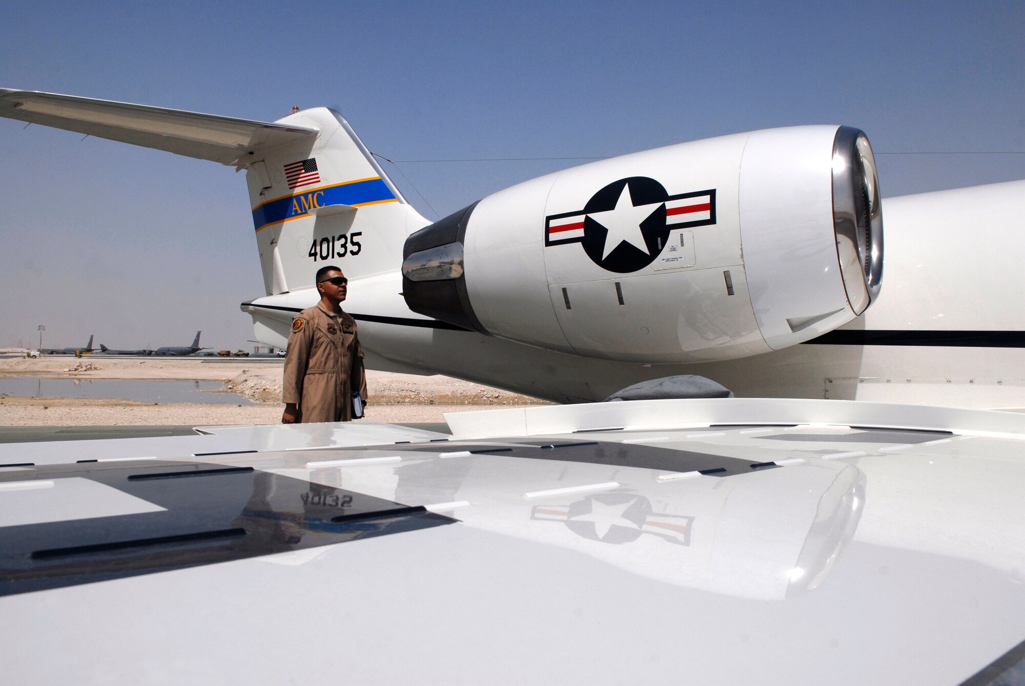 1st Lt. Luis Garces, a 379th Expeditionary Operations Group C-21 Pilot, performs a pre-flight inspection on a USAF C-21 aircraft, Apr. 15, 2009, at an undisclosed location in Southwest Asia.  The C-21 is an operational support airlift aircraft for transporting personnel and provides emergency medical evacuation transport if needed within the U.S. Central Command's Area of Responsibility.  Lt. Garces hails from Queens, N.Y. and is deployed from Scott Air Force Base, Ill. in support of Operations Iraqi and Enduring Freedom and Combined Joint Task Force - Horn of Africa.  (U.S. Air Force photo/Senior Airman Andrew Satran/released)