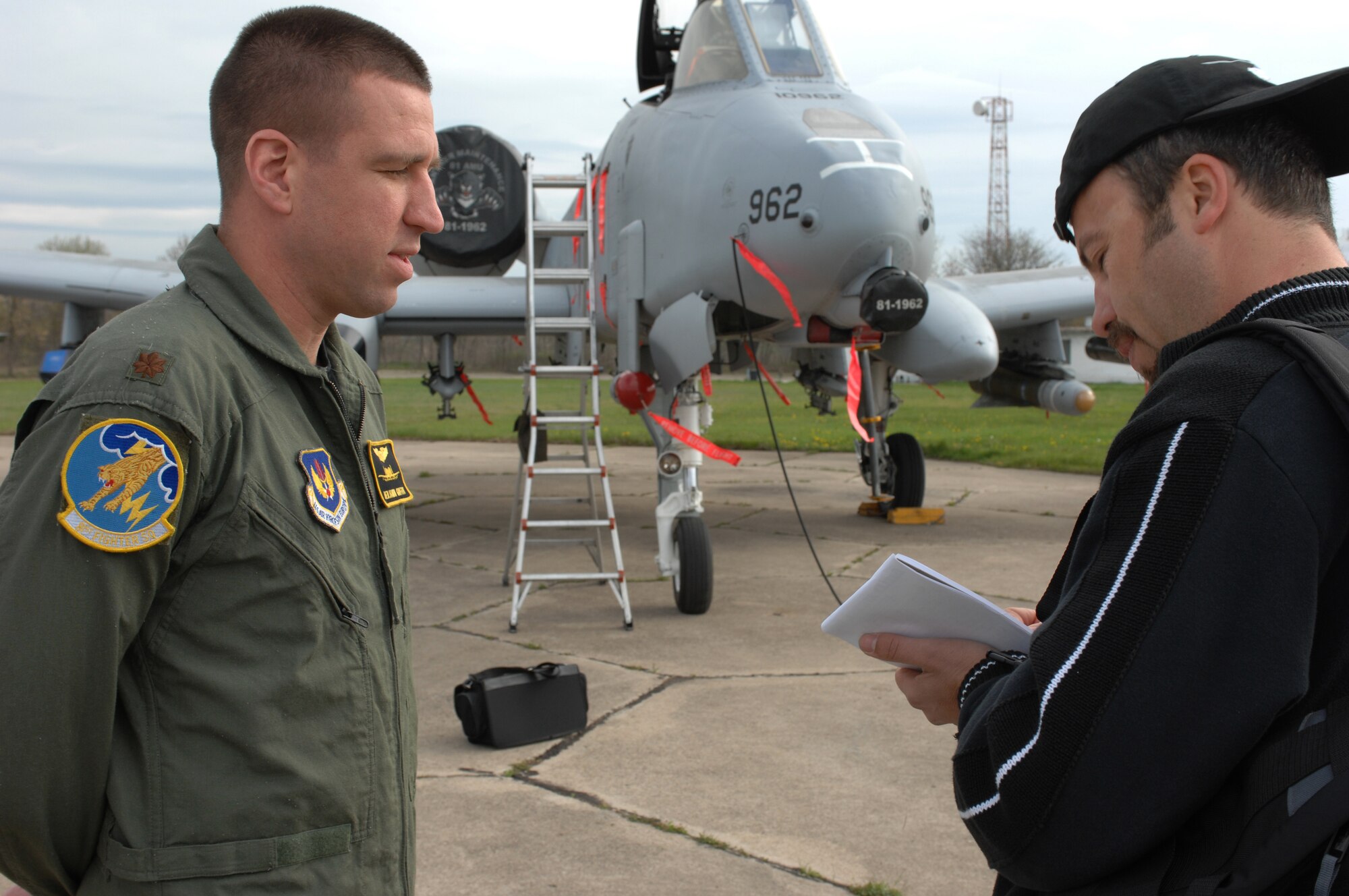 BEZMER AIR BASE, Bulgaria – Maj. Benjamin “Fletch” Griffith, 81st Fighter Squadron A-10 fighter pilot, answers a reporter’s inquiries regarding a U.S. and Bulgarian Air Forces joint training exercises April 15, 2009.  Major Griffith was a liaison officer between the Air Force and Bulgarian media during the “Reunion April 2009” media day. (U.S. Air Force photo by Master Sgt. Bill Gomez) 