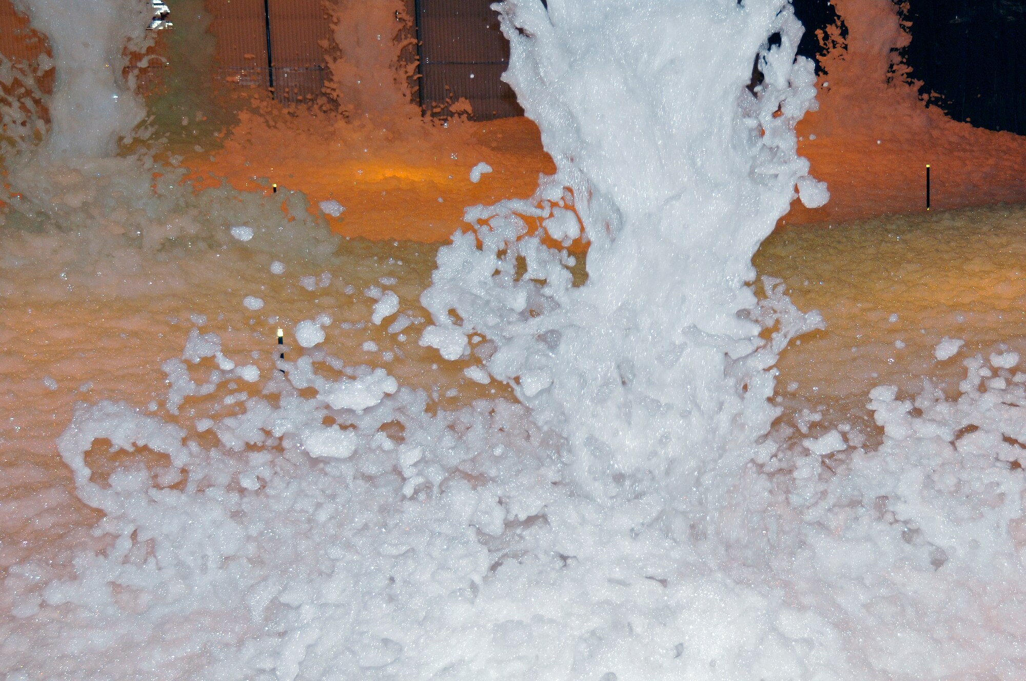 ROYAL AIR FORCE LAKENHEATH -- Firefighting foam fills up hangar 7 here April 20, 2009. The hangar had to be filled with three feet of foam in under four minutes to pass the Fire Suppression System certification. (U.S. Air Force photo by Airman 1st Class Perry Aston) (Released)
