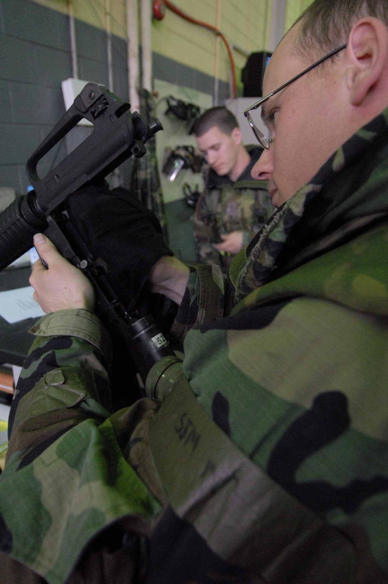 Senior Airman Jerad Davis, 8th Logistic Readiness Squadron, cleans his M-16 rifle during the Operational Readiness Inspection at Kunsan Air Base, Republic of Korea, April 21, 2009. Airman Davis is a member of the squadron's Selective Arming team. The SELARM program allows squadrons to provide their own trained and armed Airmen to protect their facilities, enabling security forces Airmen to provide more robust protection to the base. (Photo by Senior Airman Gustavo Gonzalez)