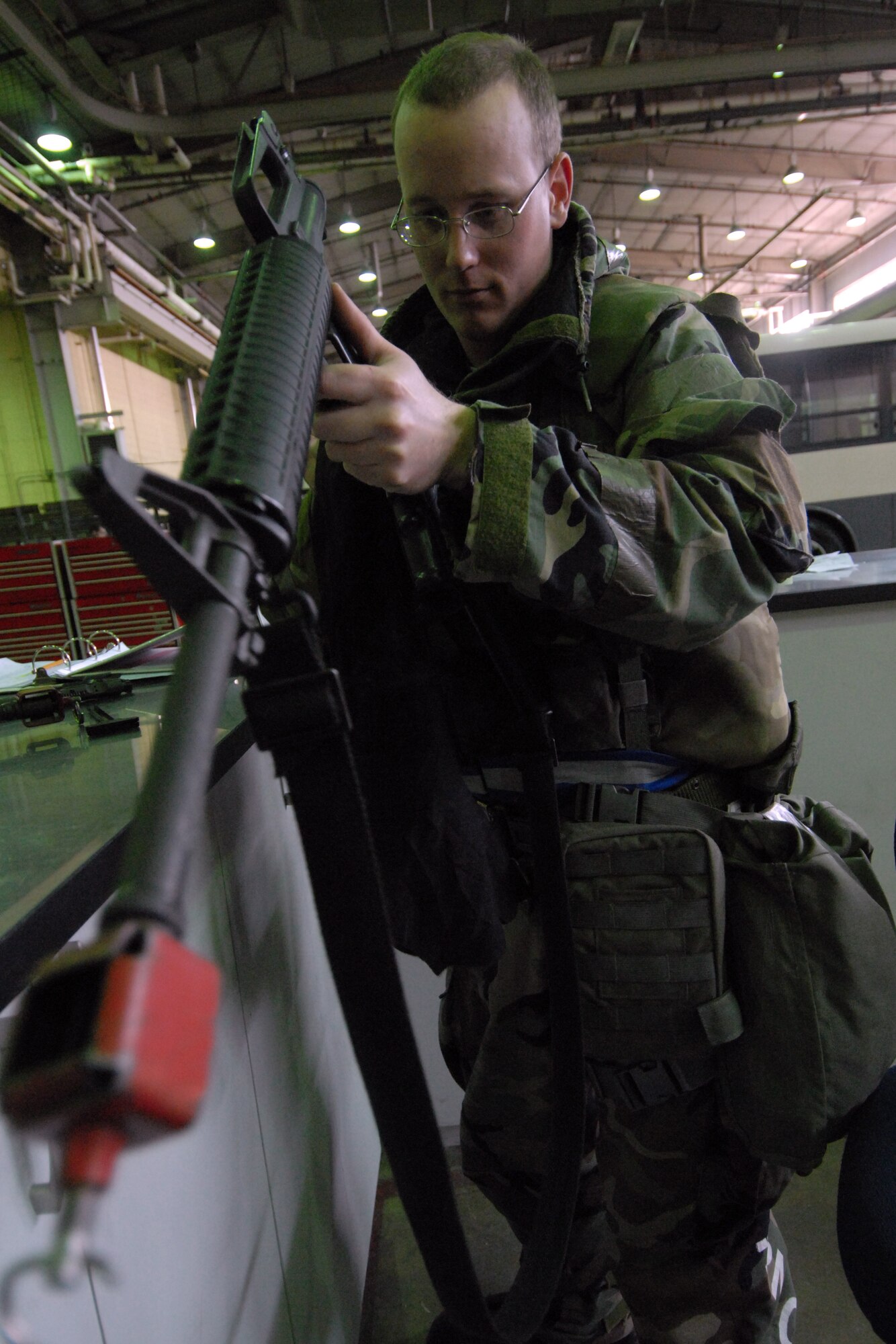Senior Airman Jerad Davis, 8th Logistic Readiness Squadron, cleans the breach of his M-16 rifle during the Pacific Air Forces Operational Readiness Inspection at Kunsan Air Base, Republic of Korea, April 21, 2009. Airman Davis is a member of the squadron's Selective Arming team. The SELARM program allows squadrons to provide their own trained and armed Airmen to protect their facilities, enabling security forces Airmen to provide more robust protection to the base. (Photo by Senior Airman Gustavo Gonzalez)