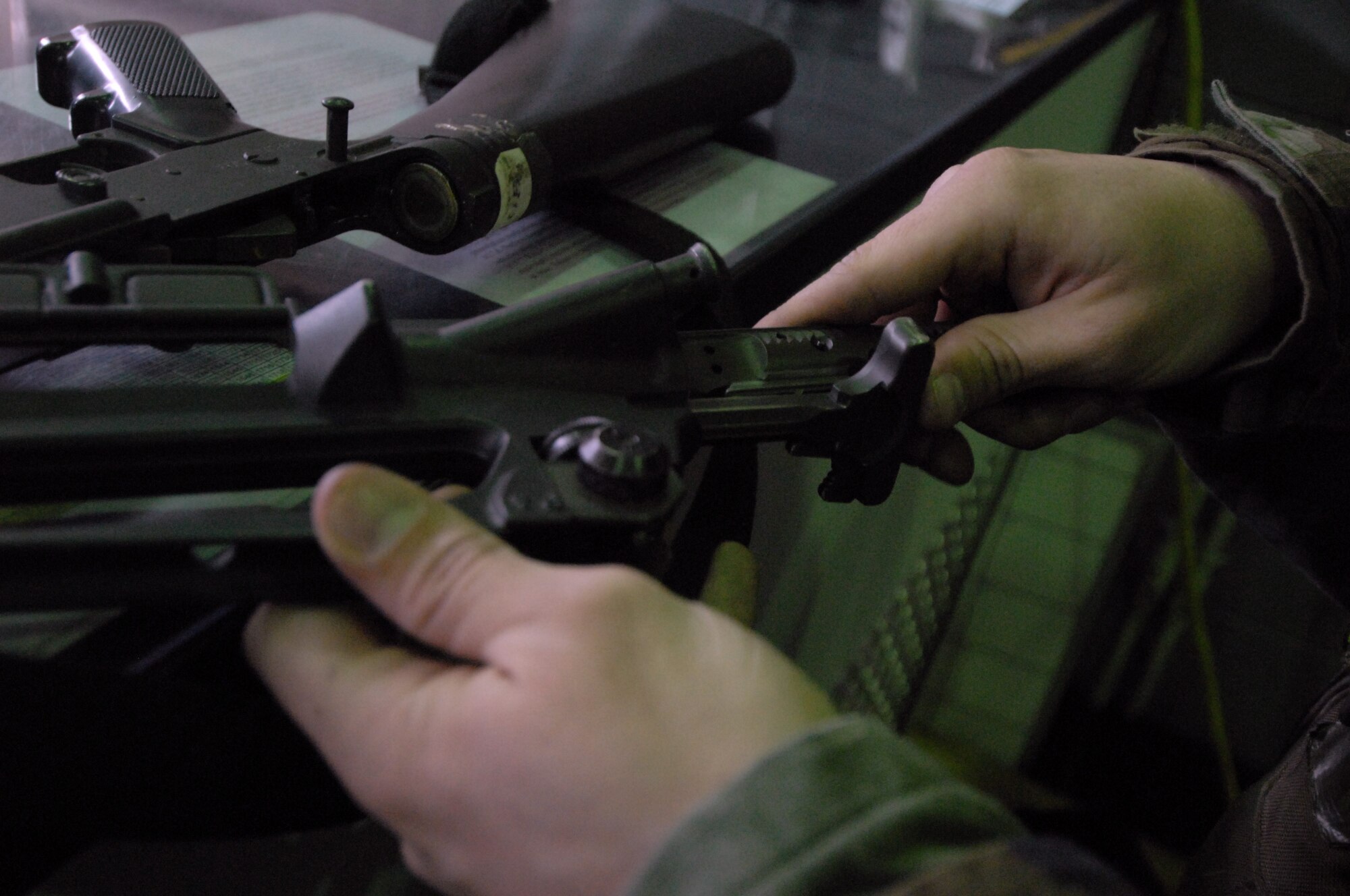 Senior Airman Kyle Salyer, 8th Logistic Readiness Squadron, re-attatches the bolt carrier as he cleans his M-16 rifle during the Pacifi Air Forces Operational Readiness Inspection at Kunsan Air Base, Republic of Korea, April 21, 2009. Airman Salyer is a member of the squadron's Selective Arming team. The SELARM program allows squadrons to provide their own trained and armed Airmen to protect their facilities, enabling security forces Airmen to provide more robust protection to the base. (Photo by Senior Airman Gustavo Gonzalez)