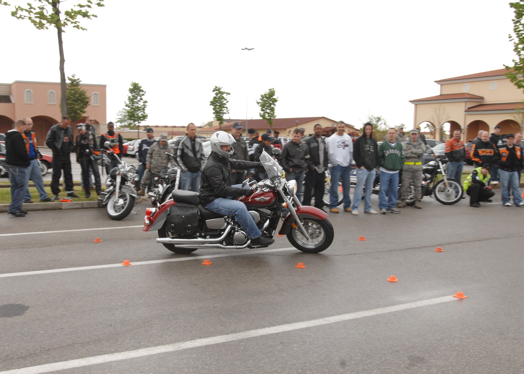 Capt. Patrick Rickheim, 31st Dental Squadron, completes the obstacle course during the Second Annual Aviano Motorcycle Rodeo April 20 in the base exchange parking lot.  The competition challenged riders to maneuver safely through areas with limited space. The all day event kicked off with a mandatory safety briefing for all base motorcyclists, followed by individual inspections, competitions and local area rides. (U.S. Air Force photo/Airman 1st Class Tabitha M. Mans)