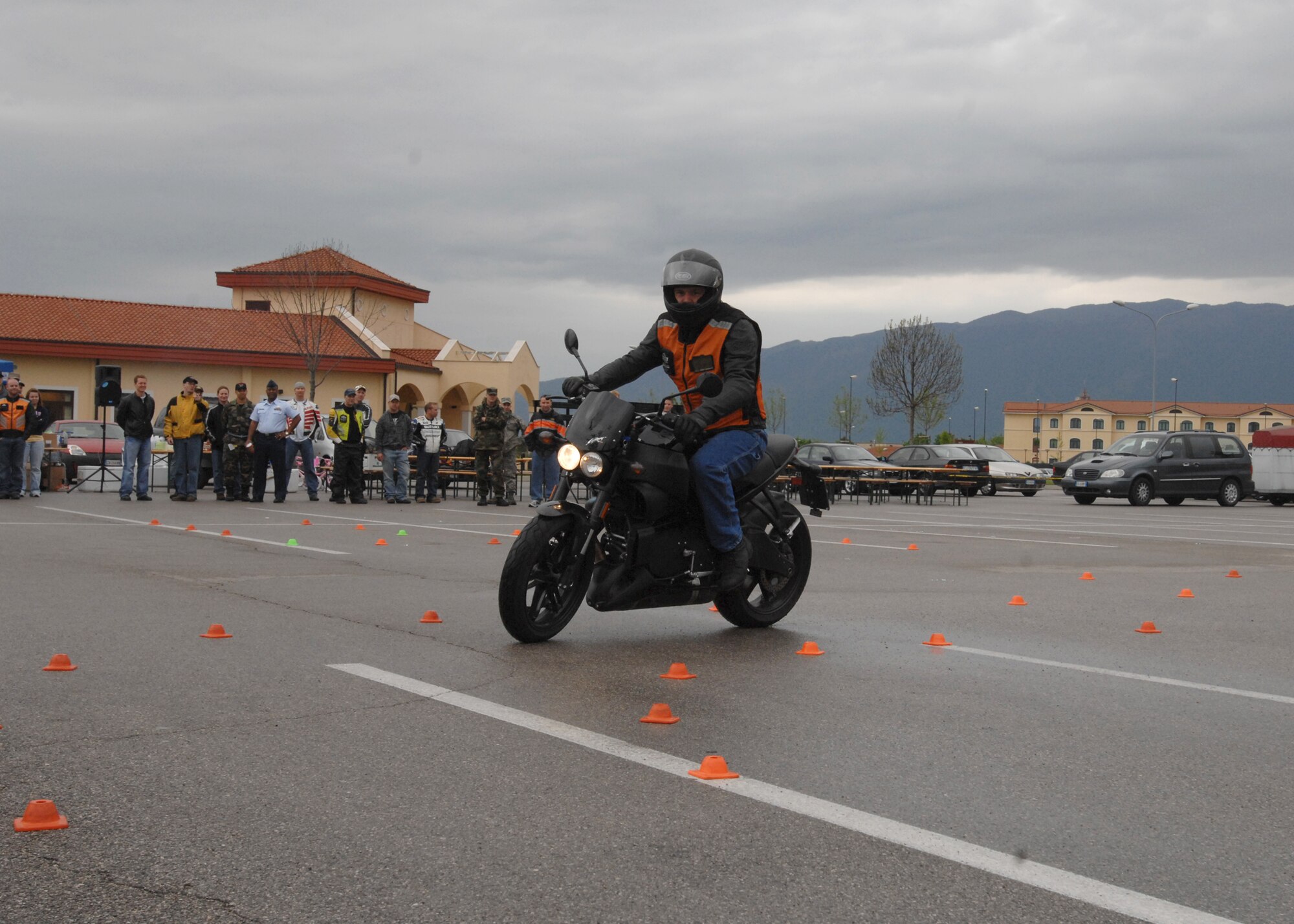 Staff Sgt. David Crouse, 31st Maintenance Squadron, demonstrates the obstacle course route for fellow riders during the Second Annual Aviano Motorcycle Rodeo April 20 in the base exchange parking lot.  The competition challenged rides to maneuver safely through areas with limited space. The all day event kicked off with a mandatory safety briefing for all base motorcyclists, followed by individual inspections, competitions and local area rides. (U.S. Air Force photo/Airman 1st Class Tabitha M. Mans)