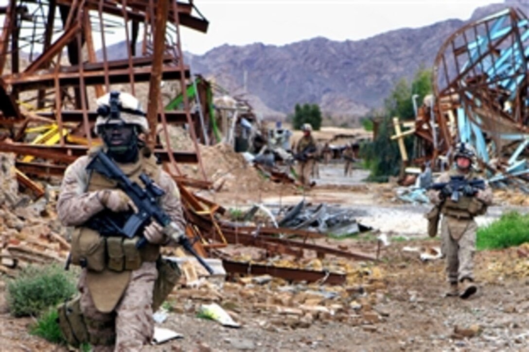 U.S. Marines conduct a security patrol through the abandoned village of Now Zad in Helmand province, Afghanistan, April 12, 2009.