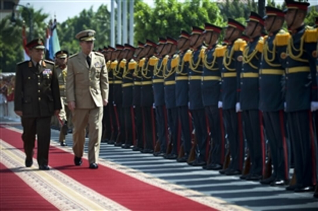 Egyptian Chief of Defense Army Lt. Gen. Samy Anan escorts U.S. Navy Adm. Mike Mullen, chairman of the Joint Chiefs of Staff, as they review Egyptian servicemembers during a welcoming ceremony to Cairo, Eqypt, April 21, 2009. Mullen is on a six-day tour of the U.S. Central Command area of operations escorting a USO tour, meeting with counterparts and visiting troops.