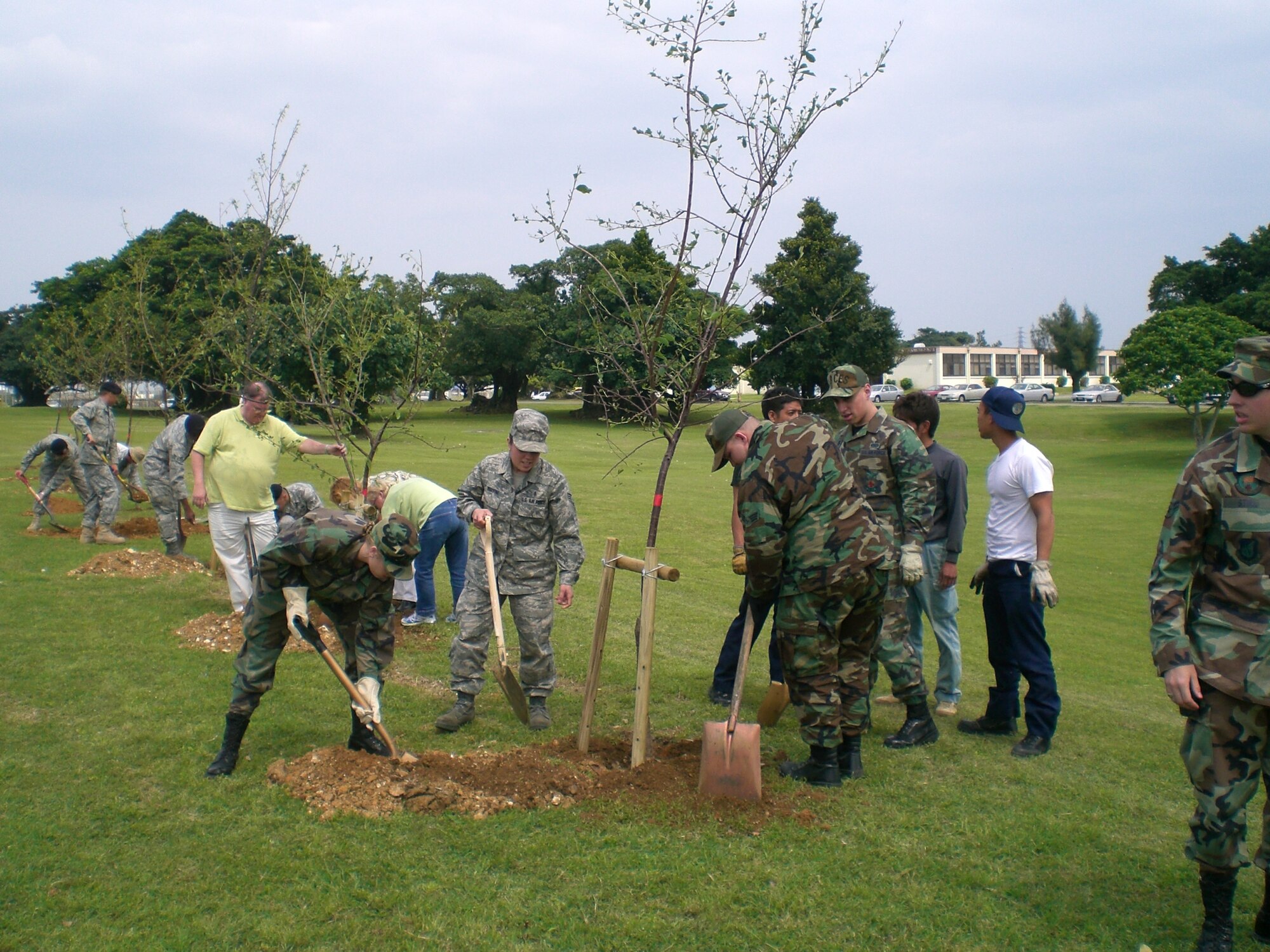 Team Kadena members get together to plant trees in Maerk Park, during Earth Day
2008. (Courtesy photo)
