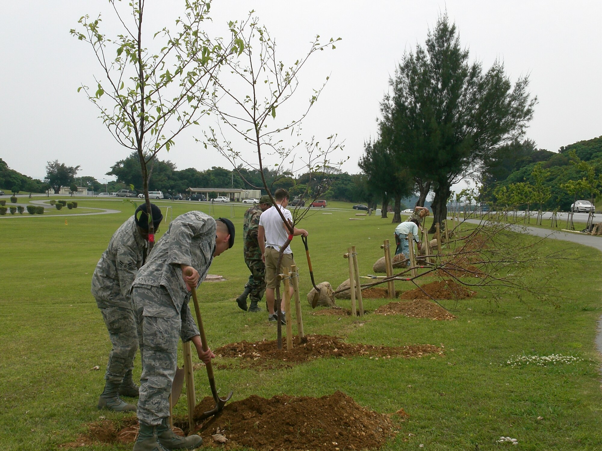 Team Kadena members get together to plant trees in Maerk Park, during Earth Day
2008. (Courtesy photo)
