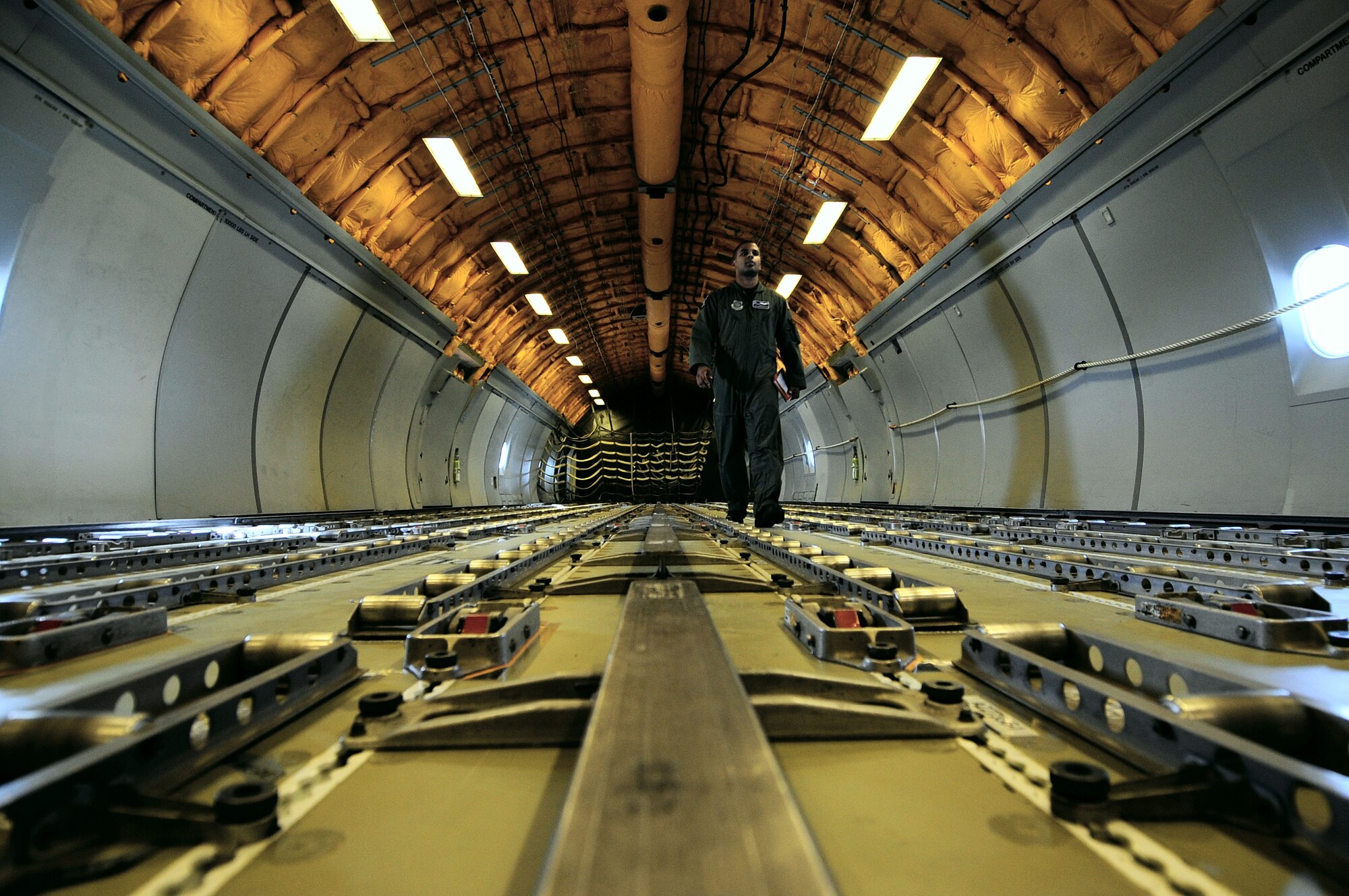 Senior Airman Pavel Del Monte, 6th Air Refueling Squadron, Travis Air Force Base, Cali., walks to the rear of a KC-10 Extender in preparation for inbound fighter jets needing fuel during RED FLAG-Alaska 09-2 April 22, 2009, Eielson Air Force Base, Alaska. The Tanker Task Force supports all aerial refueling missions during this exercise over the Joint Pacific Alaskan Range Complex.  (U.S. Air Force Photo/Senior Airman Jonathan Snyder)