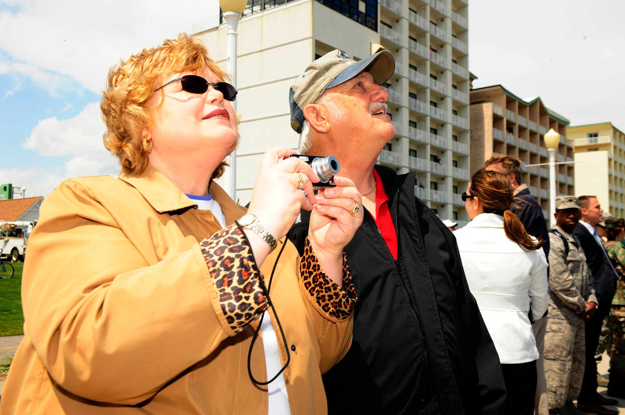 LANGLEY AIR FORCE BASE, Va. -- Nancy and David Cowan from Frostburg, Md., look on as F-15s and F-22A Raptors simulate a post battle assessment from the air during the Joint Airpower Demonstration at Virginia Beach boardwalk April 22. The demonstration showcased the critical role air power plays in the joint fight. This is one of many events going on in the Hampton Roads area as Air Force members say "thank you" to the community during Hampton Roads Air Force Week.  (U.S. Air Force photo/Staff Sgt. Jeff Nevison)