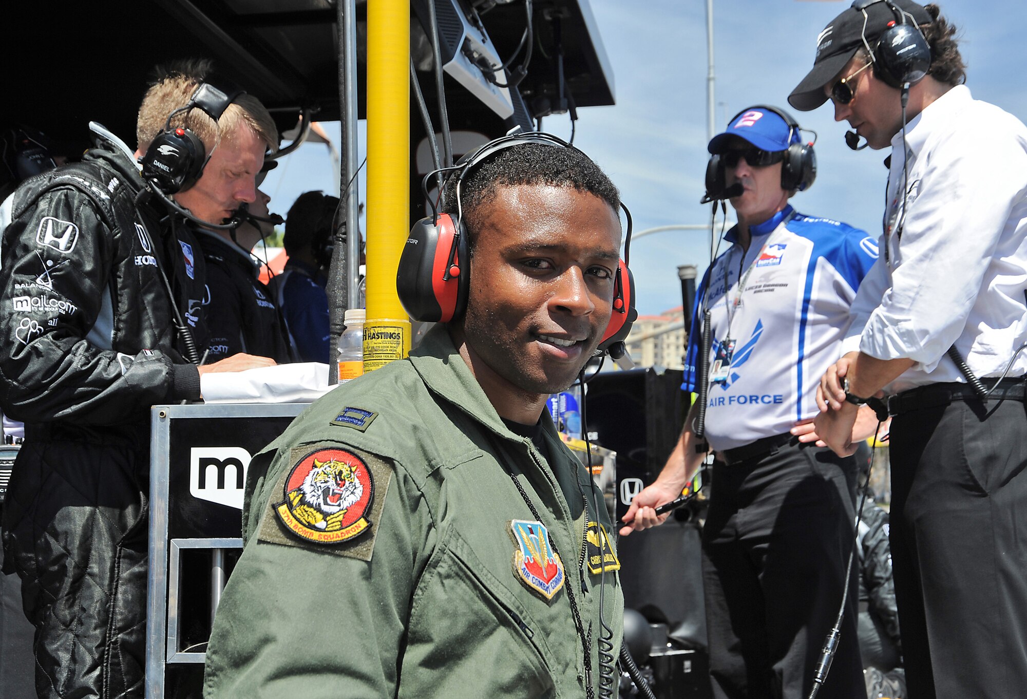 Capt. Chris McMillan was in the pit area as the ground controler for the military flyover during the Long Beach Grand Prix, April 19. (Photo by Joe Juarez)