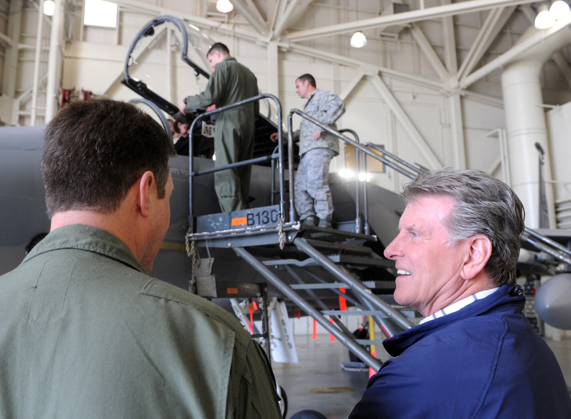 MOUNTAIN HOME AIR FORCE BASE, Idaho – Col. John Bird, 366th Fighter Wing commander, talks to Idaho Gov. C.L. “Butch” Otter while first lady Lori Otter sits in the cockpit of an F-15 during a visit to Mountain Home Air Force Base April 22. Governor Otter visited the 366th FW where he received a briefing on the base’s operations and capabilities. This is the first visit by Governor Otter to Mountain Home Air Force Base since he took office. (U.S. Air Force photo / Airman 1st Class Deborah Lockhart)