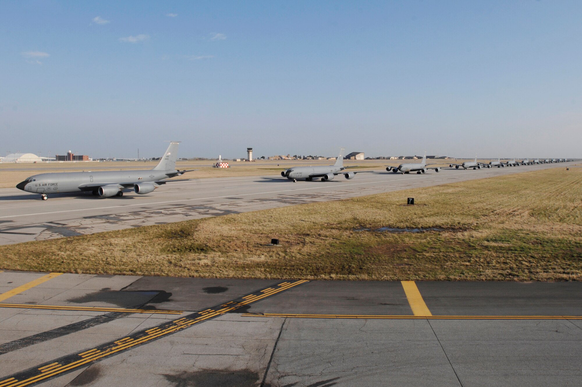 MCCONNELL AIR FORCE BASE, Kan. – Twelve KC-135 Refuelers line up during an aircraft stampede here April 16, to test the base’s ability to launch a large number of aircraft in a short period of time. This exercise was a total base effort to get the 13 crews and the 12 aircraft ready for departure. (Photo by Staff Sgt. Jamie Train)