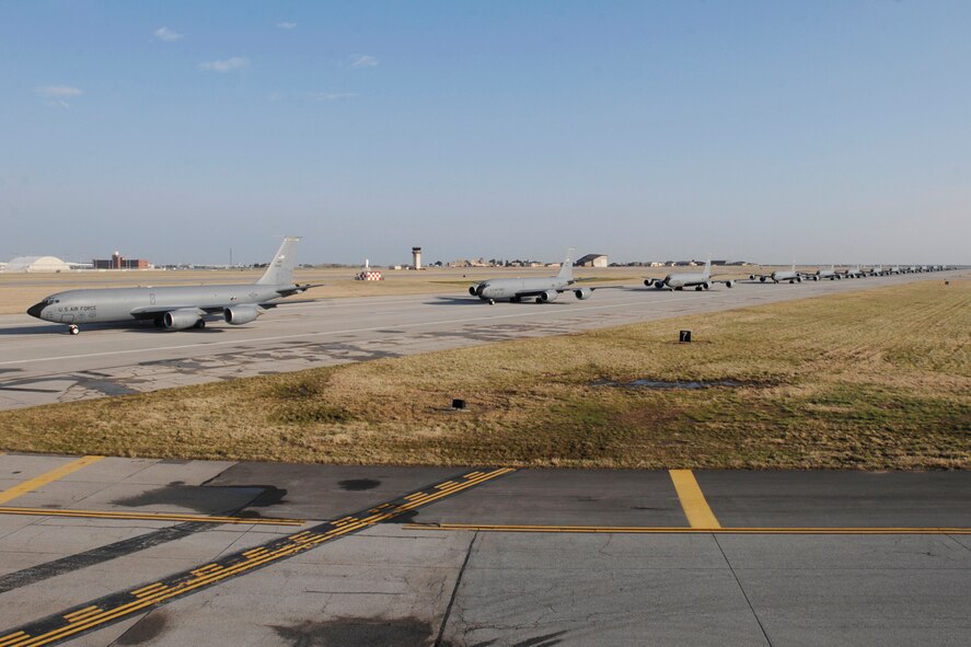 MCCONNELL AIR FORCE BASE, Kan. – Twelve KC-135 Refuelers line up during an aircraft stampede here April 16, to test the base’s ability to launch a large number of aircraft in a short period of time. This exercise was a total base effort to get the 13 crews and the 12 aircraft ready for departure. (Photo by Staff Sgt. Jamie Train)