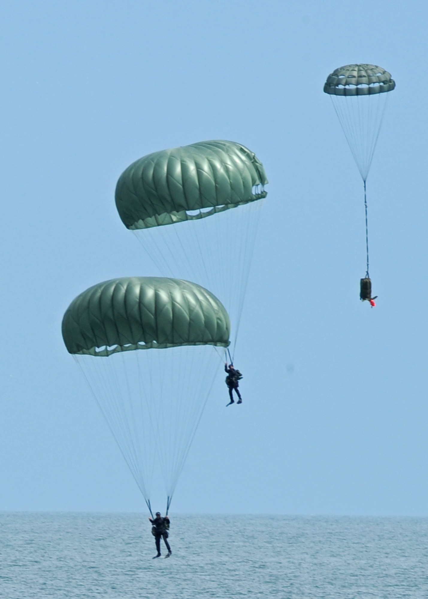 LANGLEY AIR FORCE BASE, Va. -- 38th Rescue Squadron pararescuemen, Moody Air Force Base, Ga., perform during the Joint Air Power Demonstration at the Virginia Beach boardwalk April 22. The demonstration showcased the critical role air power plays in the joint fight. This is one of many events going on in Hampton Roads Air Force Week. (U.S. Air Force photo/Airman 1st Class Jonathan Koob)   
