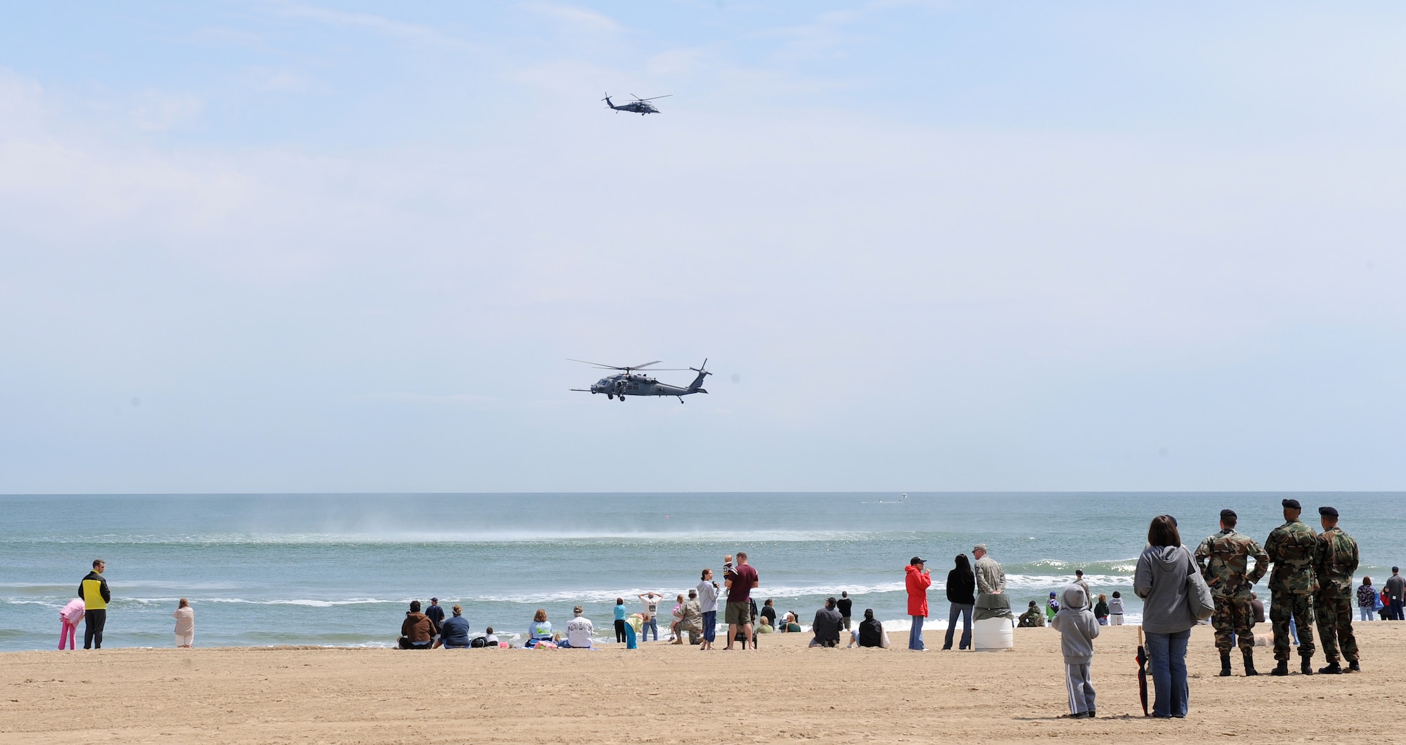 LANGLEY AIR FORCE BASE, Va. -- 41st Rescue Squadron HH-60G Pave Hawk helicopters, Moody Air Force Base,  hover over the water during the Joint Air Power Demonstration at Virginia Beach Boardwalk April 22. The demonstration showcased the critical role air power plays in the joint fight. This is one of many events going on in the Hampton Roads area as the Air Force members say “thank you” to the community during Hampton Roads Air Force Week. (U.S. Air Force photo/Airman 1st Class Gul Crockett) 
