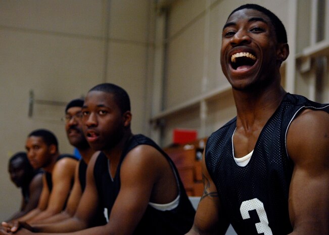 Michael Better cheers for fellow 437th Security Forces Squadron teammates during an intramural basketball playoff game against the Coast Guard at the Fitness and Sports Center here April 20. SFS defeated the CG 51-46. The championship game was April 23. Better is a member of the 437 SFS. (U.S. Air Force photo/Senior Airman Katie Gieratz)(RELEASED)