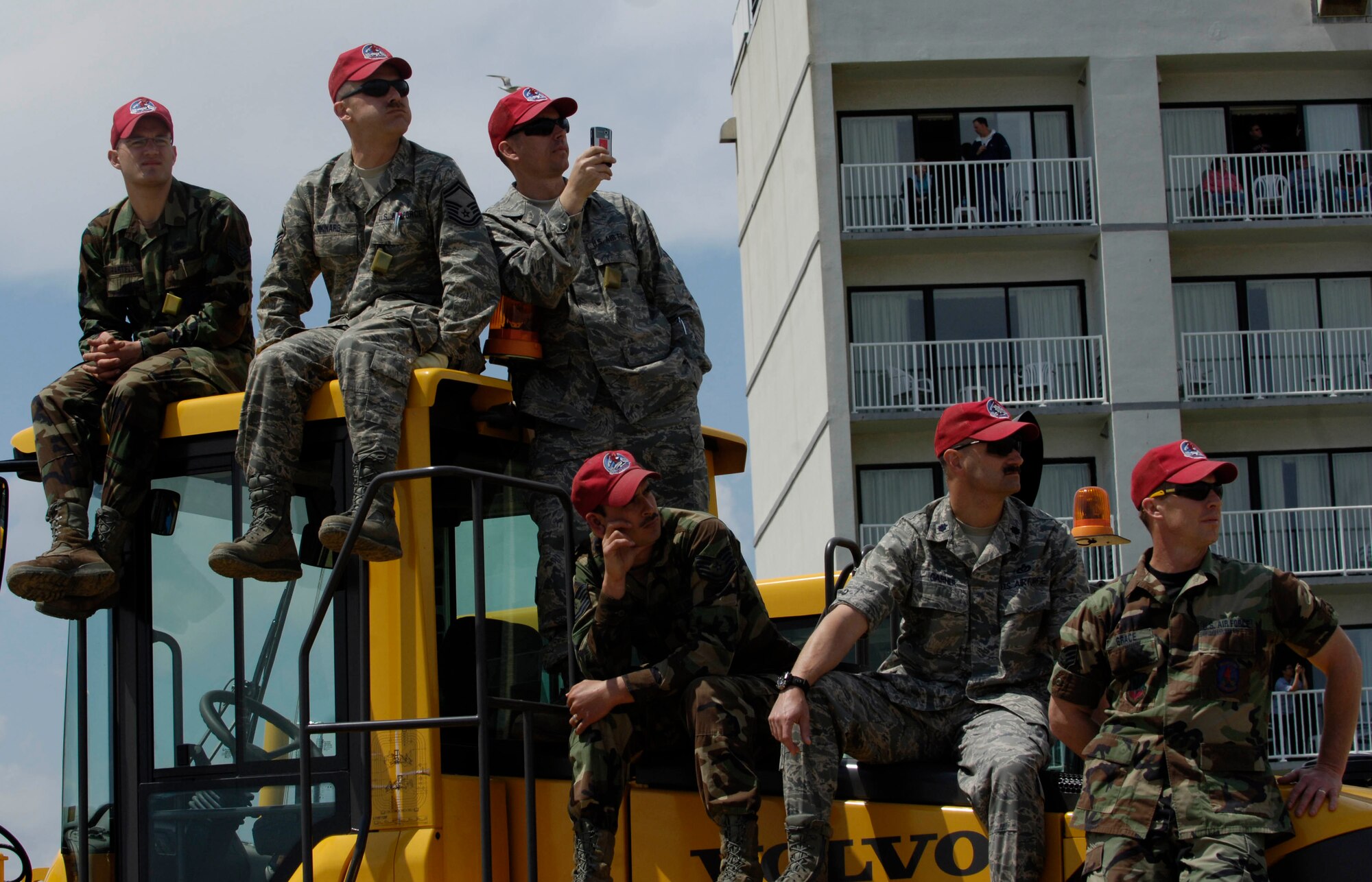 LANGLEY AIR FORCE BASE, Va. -- 1st Civil Engineering Squadron Red Horse team members watch the Joint Air Power Demonstration at the Virginia Beach Boardwalk April 22.  The demonstration showcased the critical role air power plays in the joint fight. This is one of many events going on in the Hampton Roads area as the Air Force members say "thank you" to the community during Hampton Roads Air Force Week.  (U.S. Air Force photo/Airman Rebecca Montez)
