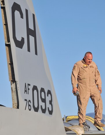 Army Sgt. Steven Watson from the 1st of the 189th Aviation Company, Nevada Army National Guard, prepares an F-15A Eagle for airlift by a CH-47 Chinook helicopter at Nellis Air Force Base, Nev., April 22.  The F-15, a non-flying maintenance training aid, was moved to nearby Creech AFB for use as an emergency egress trainer by the Creech fire department.  (U.S. Air Force photo by Gary Emery)