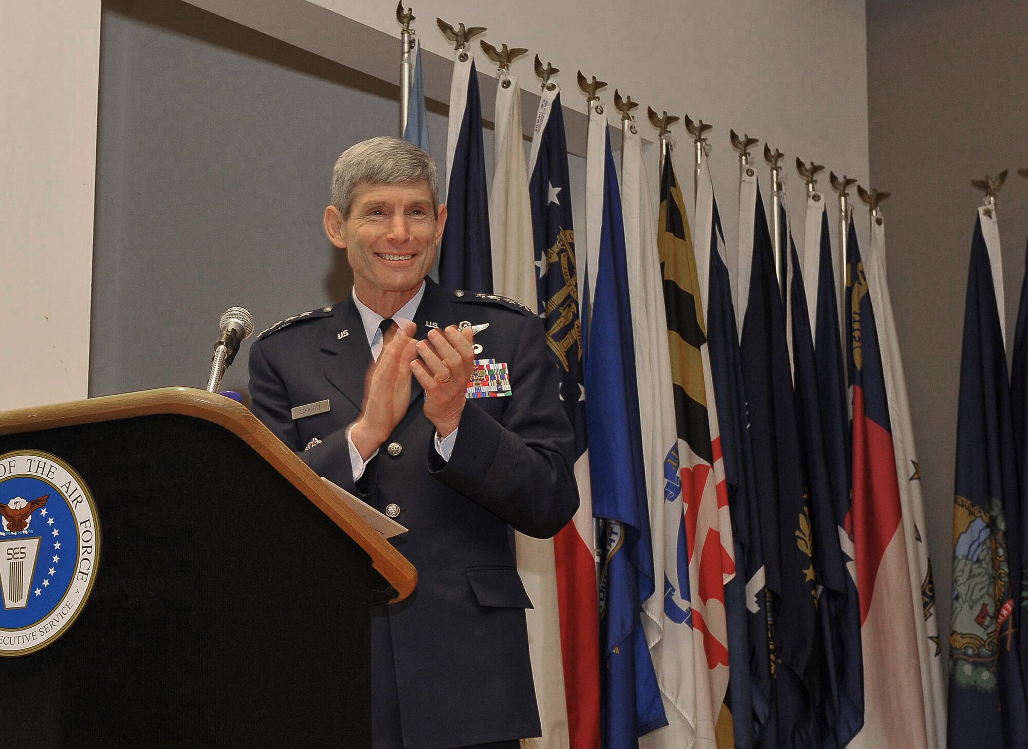 Air Force Chief of Staff Gen. Norton Schwartz congratulates recipients of the 2008 Presidential Rank Award during the presentation ceremony April 17 at the Women's Memorial in Arlington Cemetery. The president of the United States annually awards distinguished and meritorious ranks to career members of the senior executive service, to senior leaders, and to scientific and professional government employees. (U.S. Air Force photo/Michael J. Pausic)