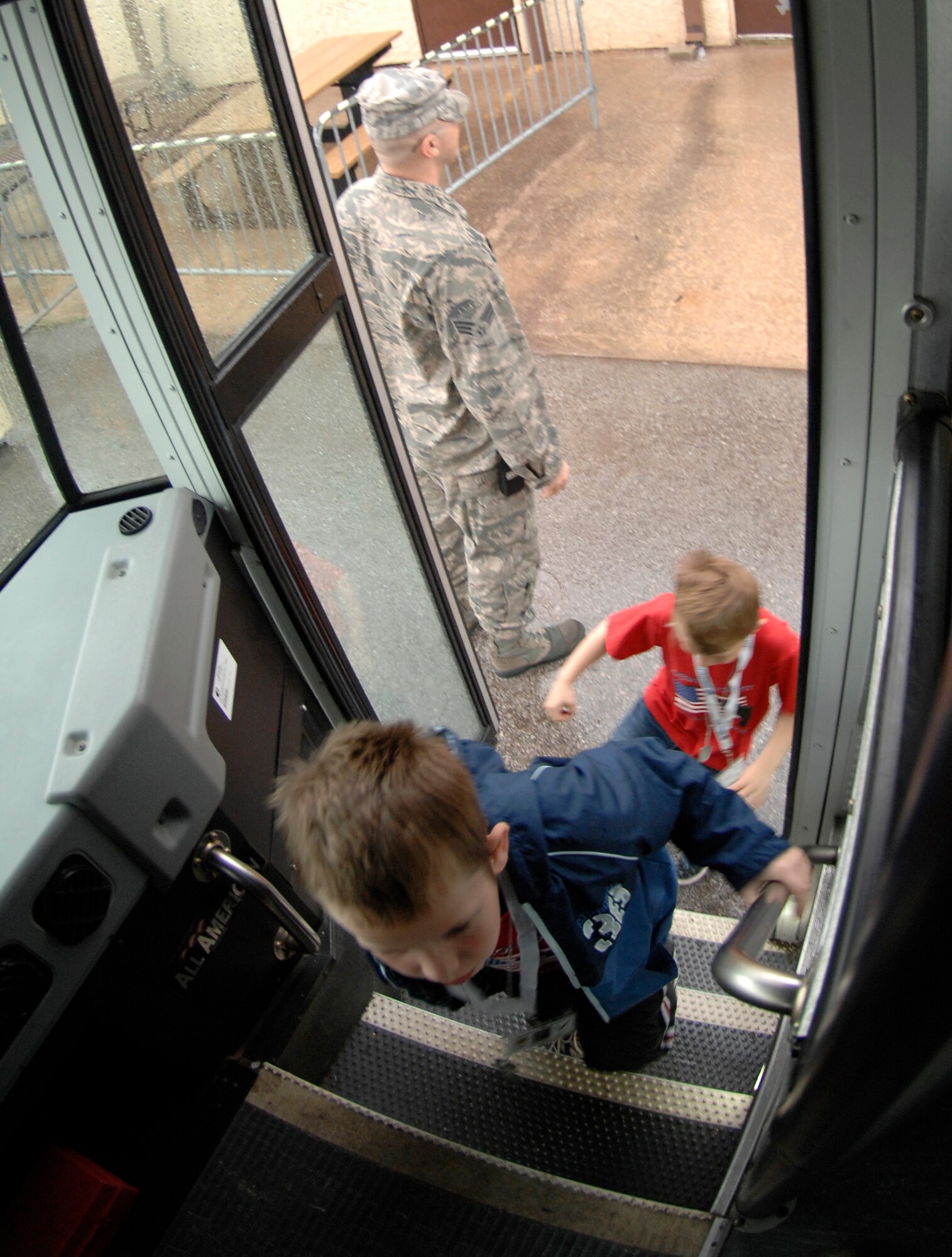 WHITEMAN AIR FORCE BASE, Mo. - Young "Airmen" load onto a bus April 18 during Operation Spirit as they prepare to go to the flightline and board an awaiting C-130. The "Airmen" participated in a mock deployment to Kabul, Afghanistan. Operation Spirit is a simulated deployment line for school-aged kids that allows children to experience what their military parents go through during a deployment. The "Airmen" were accompanied by their parents and received goodies form several base agencies. (U.S. Air Force photo/Staff Sgt. Jason Barebo)