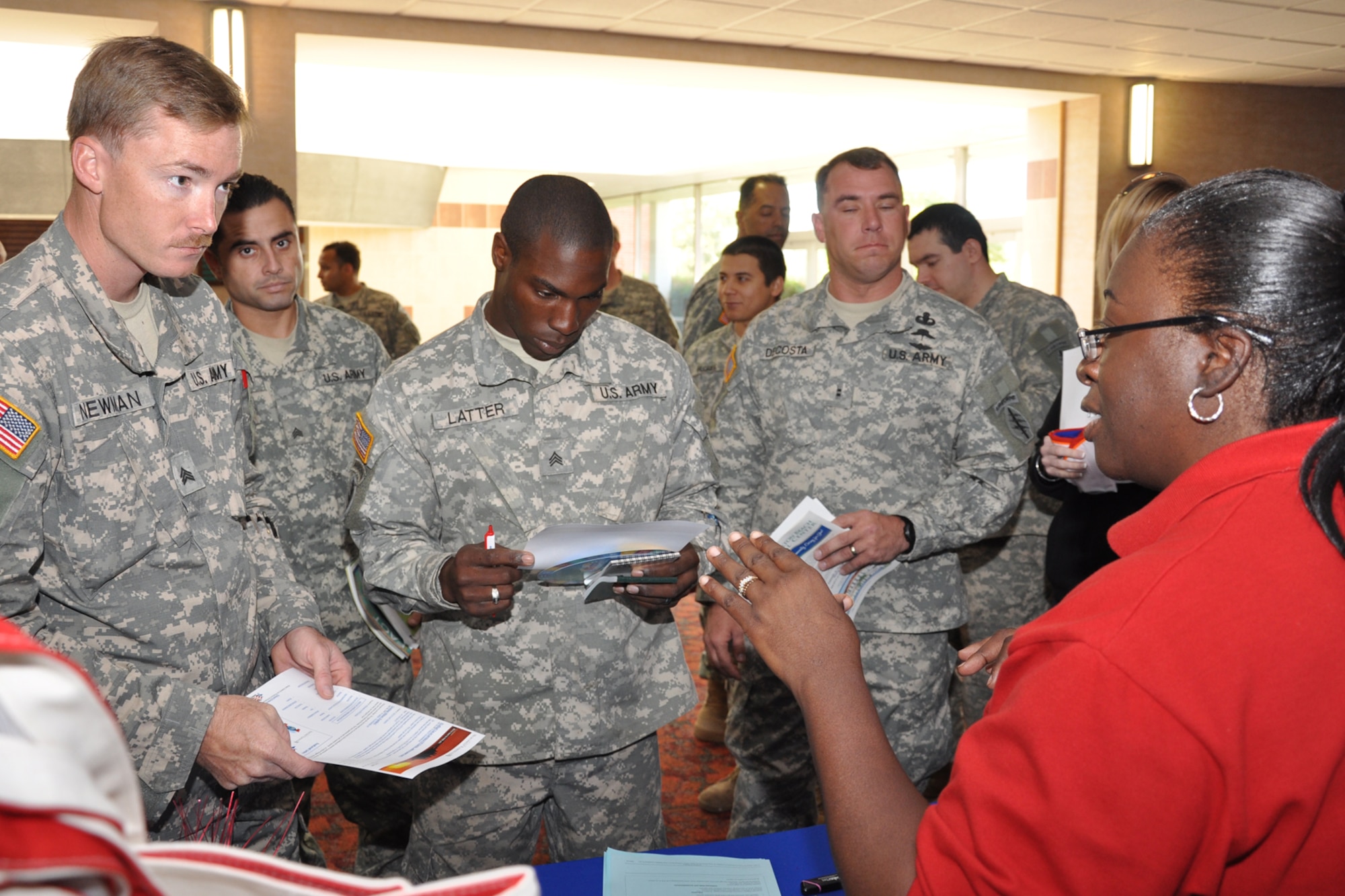 FORT BRAGG, North Carolina -- DeAndrea ?Dede? Haynes, BRAC Coordinator Workforce Development Board, talks to Soldiers about job opportunities around Eglin.  More than 30 representatives from Eglin traveled to Fort Bragg, April 16-18, to present 7th Special Forces Group (Airborne) members and spouses with information about the base and Northwest Florida.  More than 1,000 Soldiers and spouses attended the briefings. (Photo by Master Sgt. Andrew Leonhard)