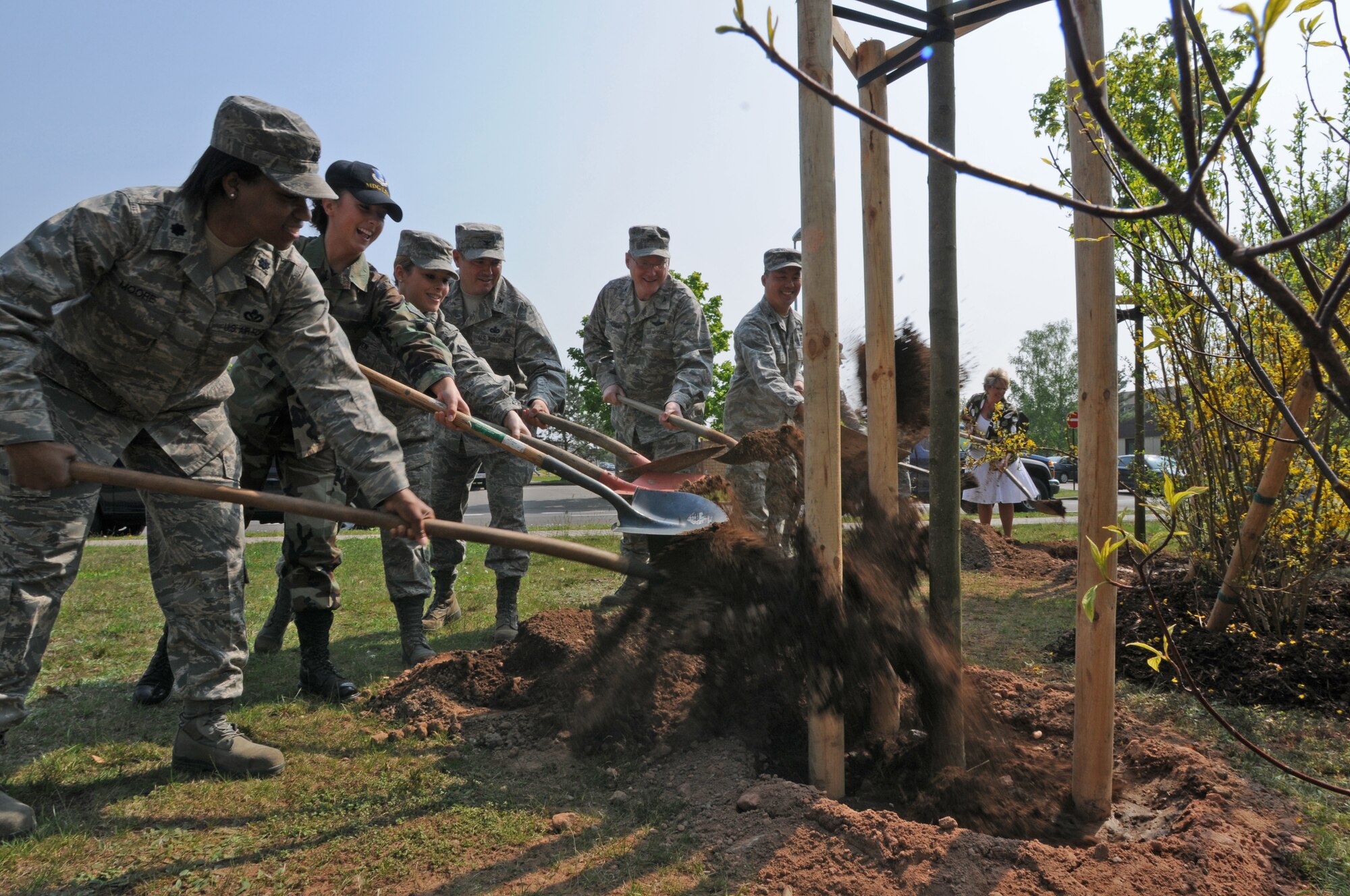 Members of Ramstein Air Base celebrate Earth day with a tree planting in front of the medical dormitories, Germany, April 22, 2009. The first Earth Day was celebrated by about 20 million people in 1970. (U.S. Air Force photo by Senior Airman Levi Riendeau)