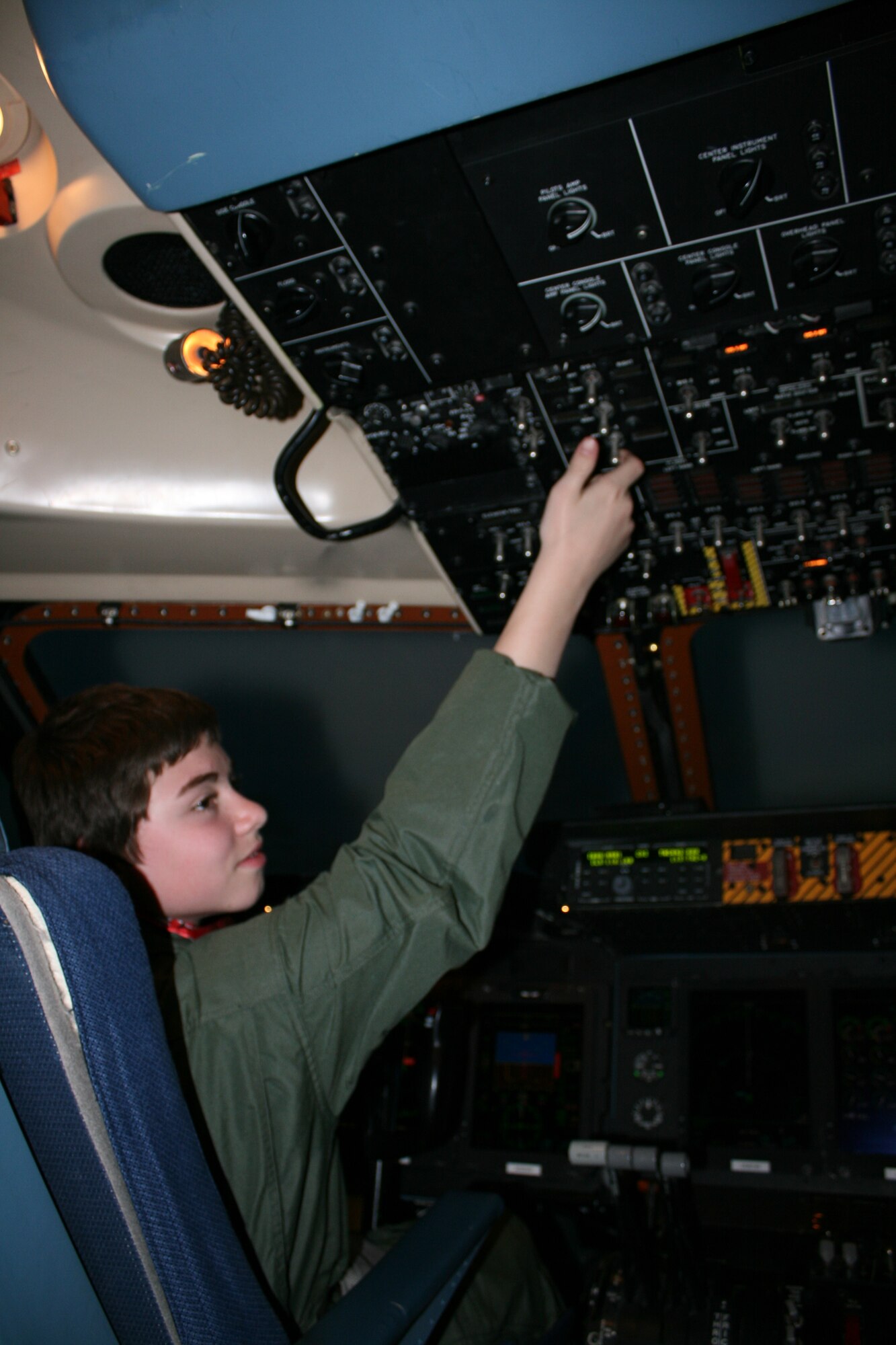Nicholas Gebhardt sits in the C-17 Globemaster III flight simulator April 16. Nicholas got to experience what it's like to be a pilot as part of the Pilot for a Day program. (U.S. Air Force photo)