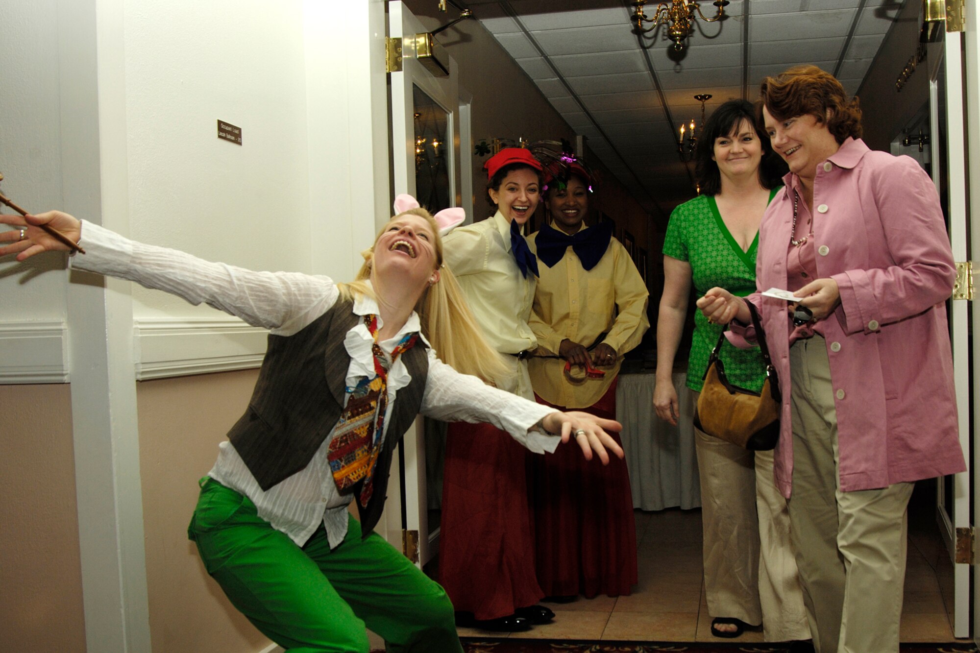 The March Hare (Karen Jenkins) welcomes guests to the Hanscom Spouses Club’s Mad Hatter Tea Party, held at the Minuteman Club on April 17. The Hanscom Spouses’ Club is open to spouses of Hanscom personnel, including active-duty servicemembers, retirees and civilians.  (Air Force photo by Linda LaBonte-Britt)