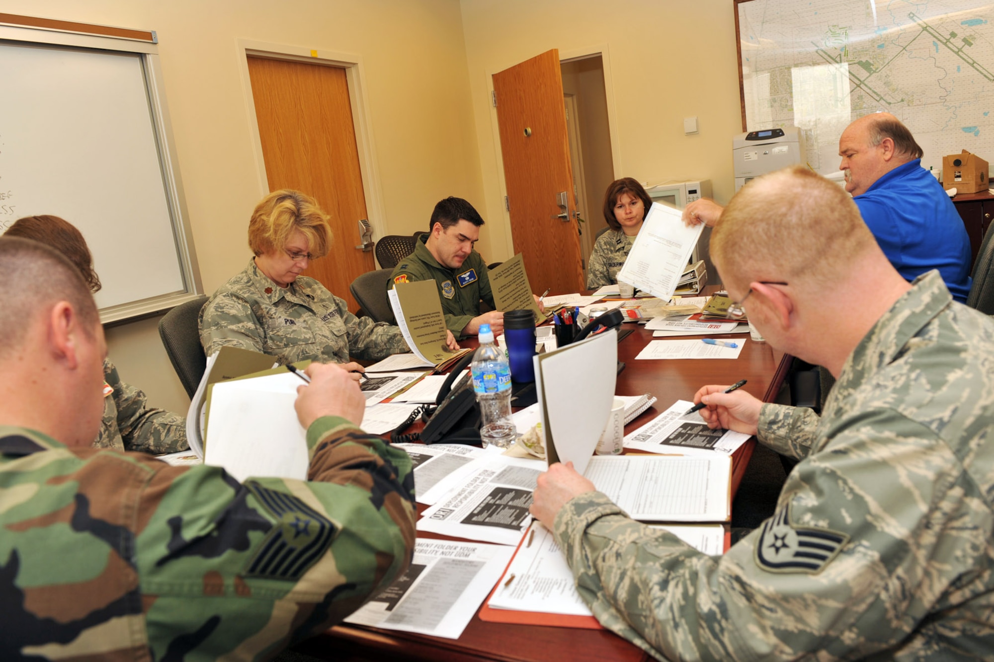SCOTT AIR FORCE BASE, Ill. --Members of the 375th Airlift Wing Exercises and Plans office review mobility folders with the 375th Medical Group unit deployment managers.(U.S. Air Force photo/Senior Airman Megan Gilliland) 