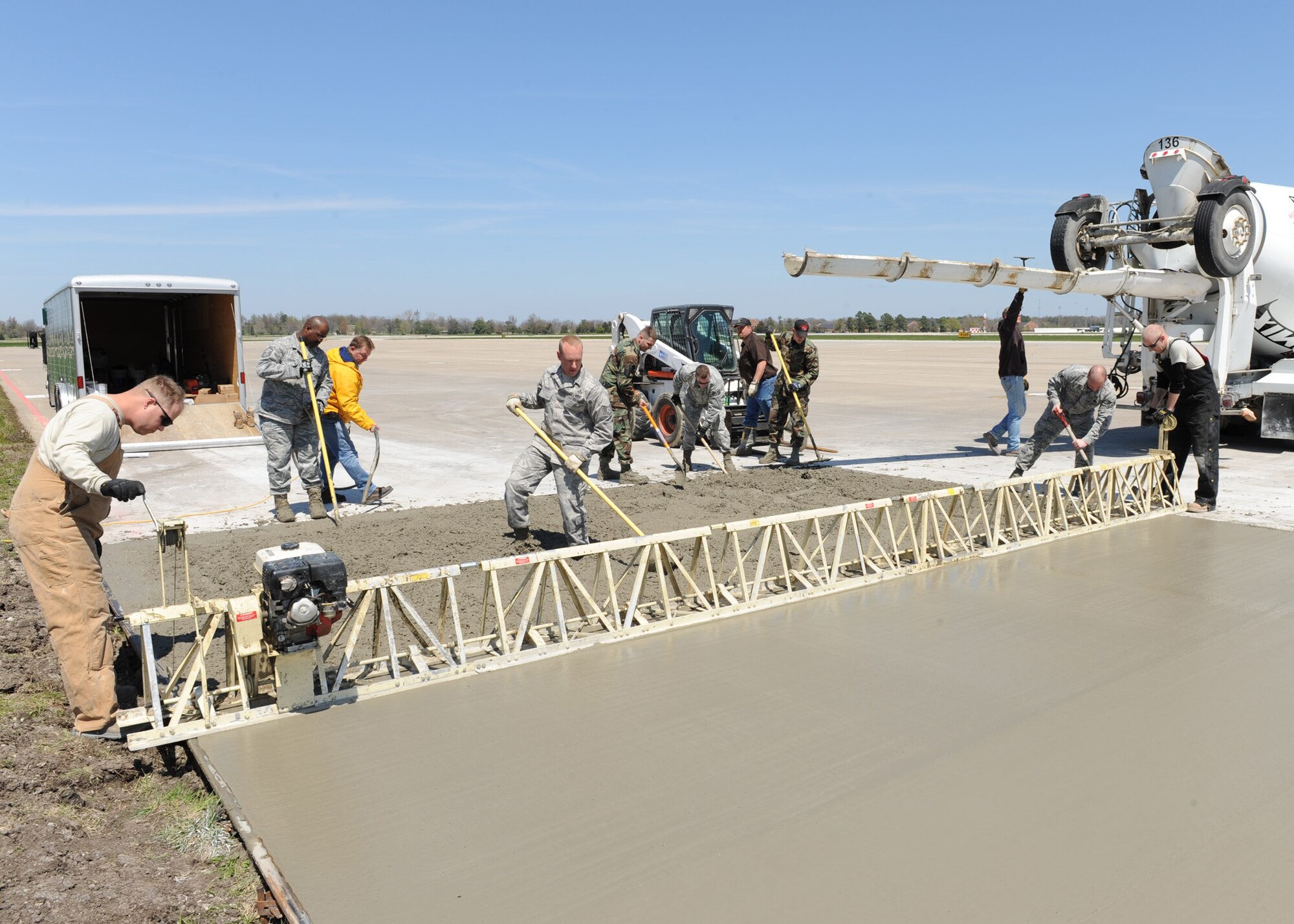SCOTT AIR FORCE BASE, Ill. --Airmen from the 375th Civil Engineer Squadron consolidate and finish a full depth repair on the tarmac of the Scott flightline. The project is the practical portion of a 10-day Pavement Maintenance Inspection Repair course. (U.S. Air Force photo/Staff Sgt. Paul Villanueva II) 