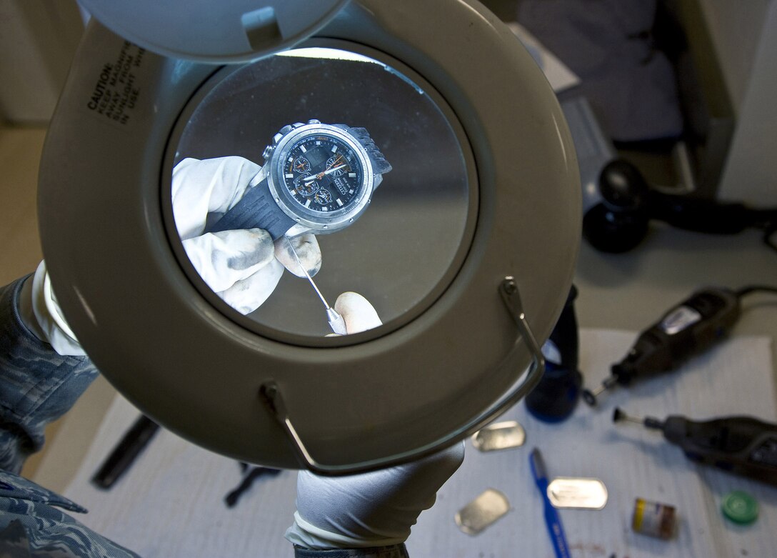 Tech. Sgt. Latersa Frazier, a personal effects supervisor, polishes a watch April 1, 2009, to demonstrate the cleaning process of personal effects conducted during preparation of the dignified transfer of remains process at the Charles C. Carson Center for Mortuary Affairs, Dover Air Force Base, Del. The personal effects office prepares and cleans all items before giving them to the families of fallen heroes. Sergeant Frazier is from the 43rd Force Support Squadron at Pope AFB, N.C. (U.S. Air Force photo/Staff Sgt. Bennie J. Davis III)