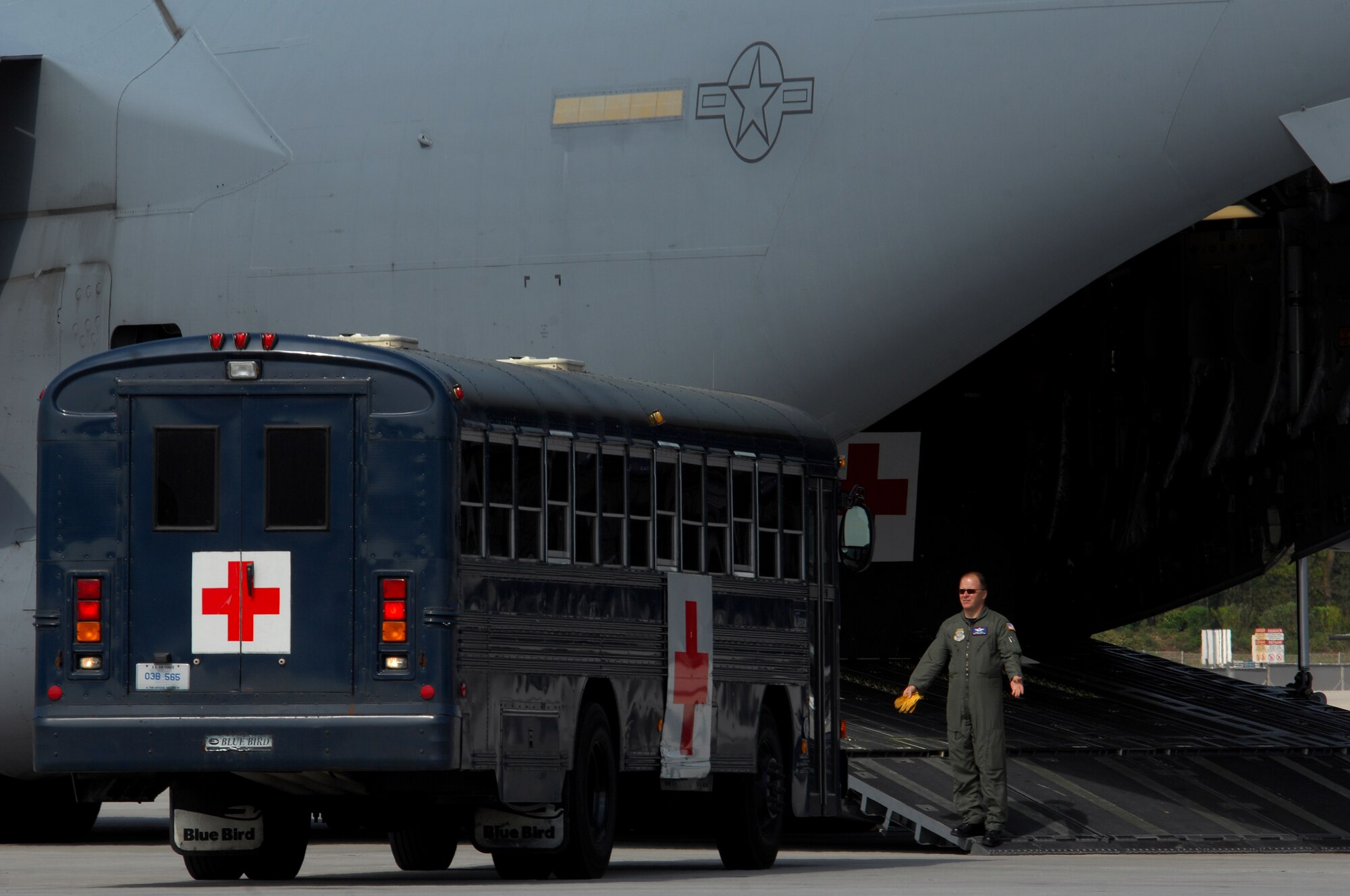 Medical busses from the 435th Contingency Aeromedical Staging Facility pull up to a C-17 Globemaster III in preparation to load patients April 21, 2009, Ramstein Air Base, Germany. Members from the CASF loaded several patients who were taken care of by members from the 86th Aeromedical Evacuation Squadron while being transported back to the continental United States for further treatment. (U.S. Air Force photo by Airman 1st Class Kenny Holston)