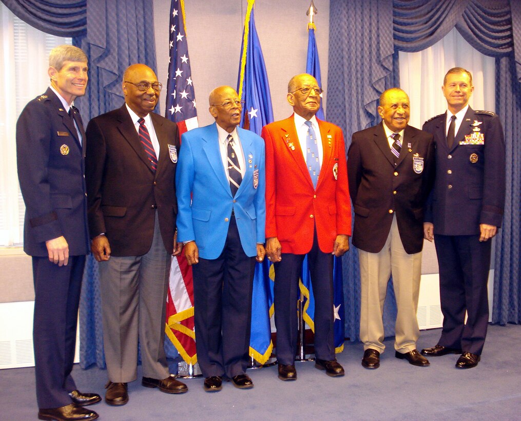 Chief of Staff of the Air Force, Gen. Norton A. Schwartz, and Vice Chief of Staff of the Air Force, Gen. William M. Fraser III, pose with four original Tuskegee Airmen in the commander's conference room in the Pentagon. The Tuskegee Airmen (from left to right Maj. (ret.) George Boyd, Lt. Col. (ret.) Alexander Jefferson, Lt. Col. (ret.) James Warren and Mr. Philip Broome) departed for a visit with U.S., and coalition forces in the area of responsibility on April 20, 2009.  (U.S. Air Force photo/Maj. Andra P. Higgs) 